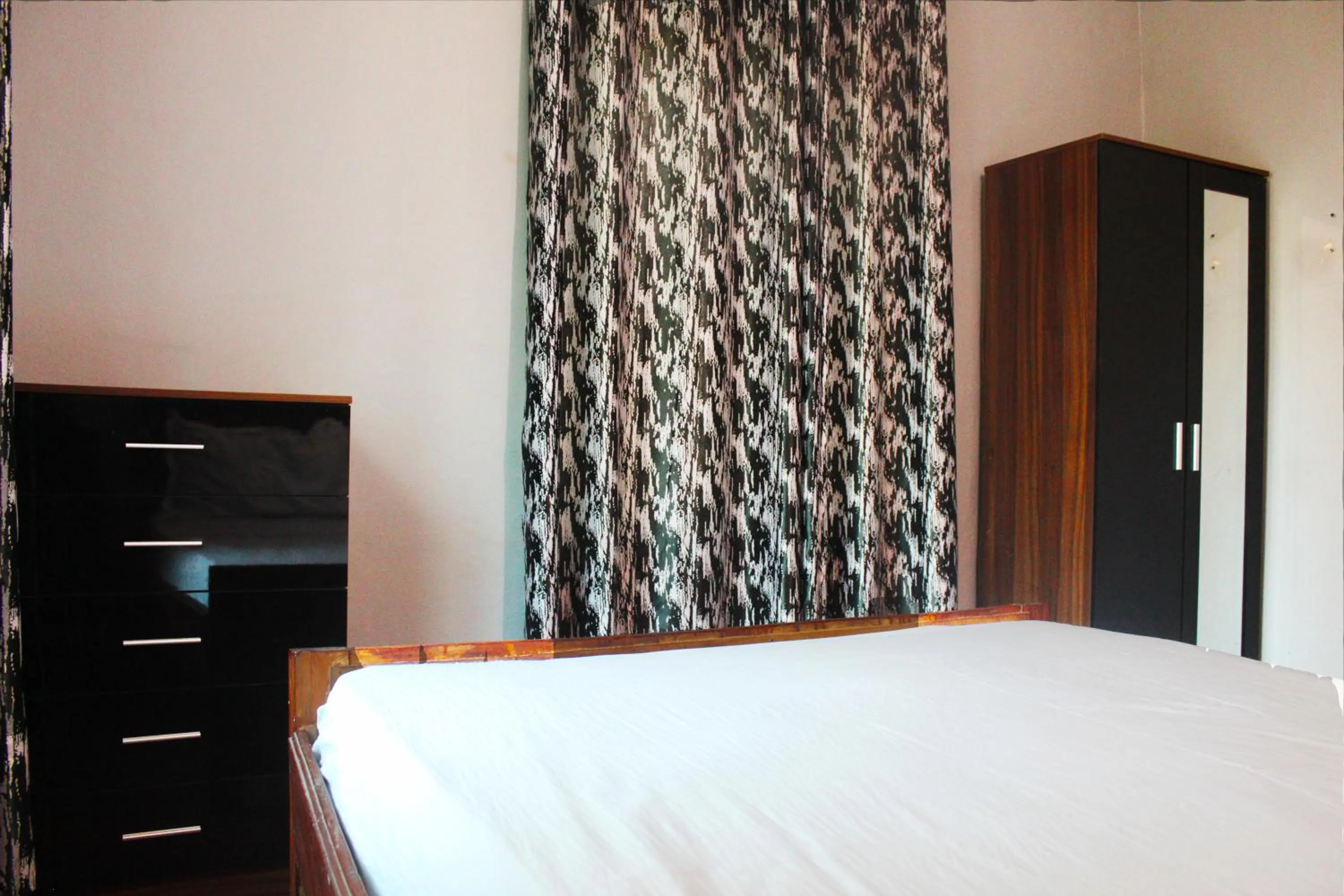 Bedroom, Bed in Harmony house apartments