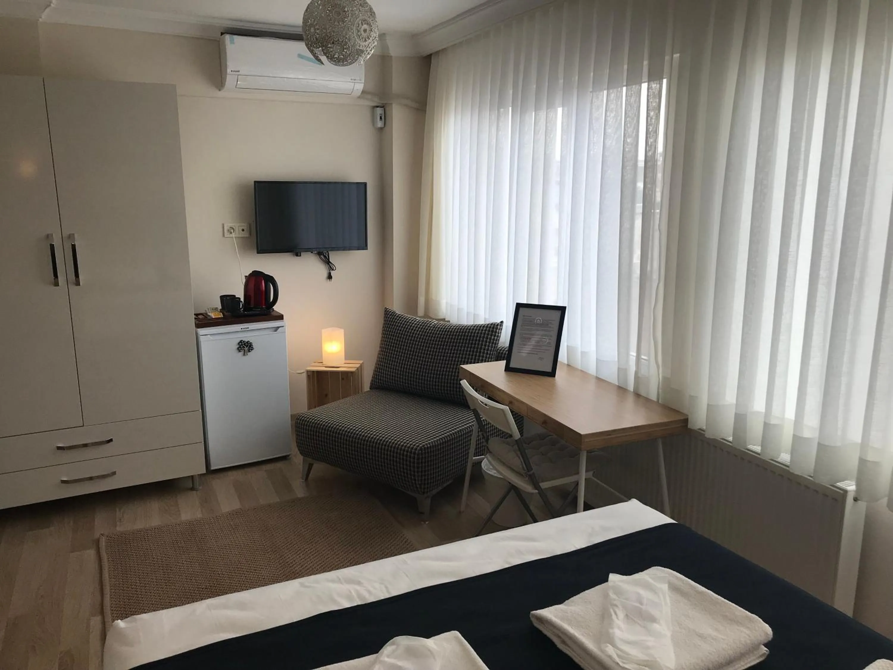 Living room, Bed in Goji's Apartments