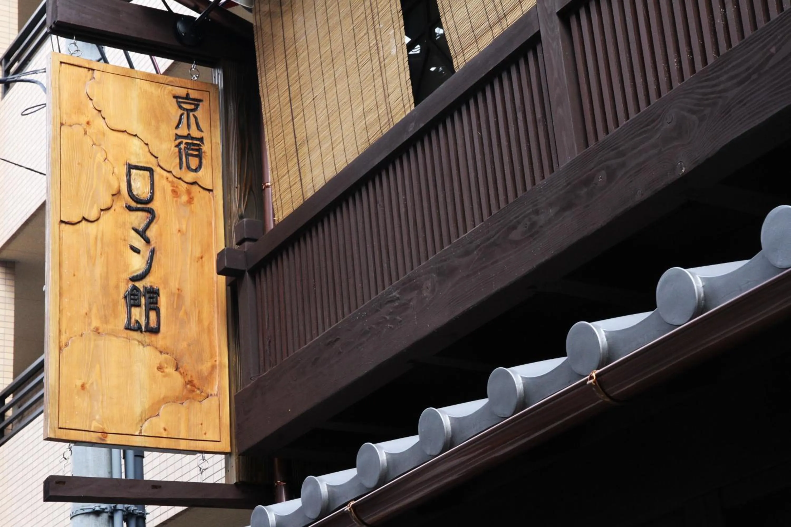 Property logo or sign in Roman Kan