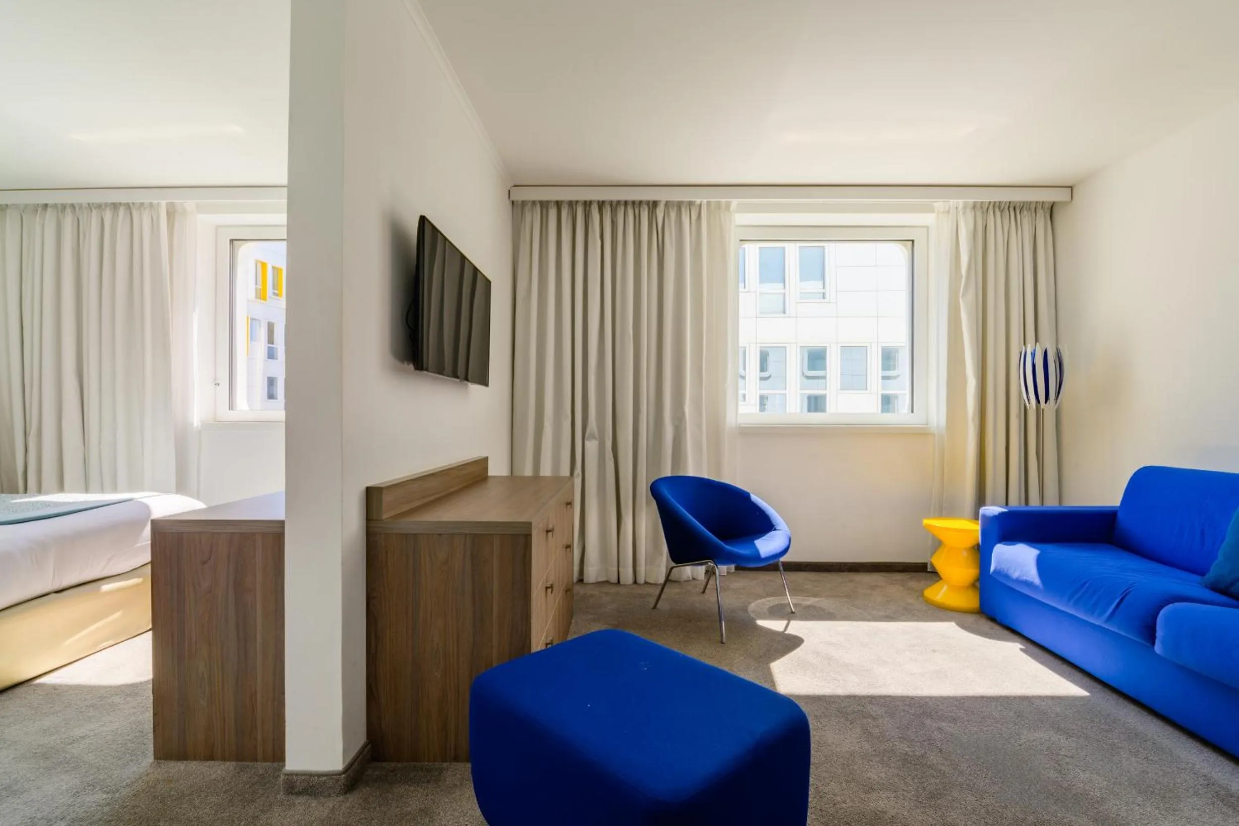 Seating area, Bed in Golden Tulip Marseille Euromed