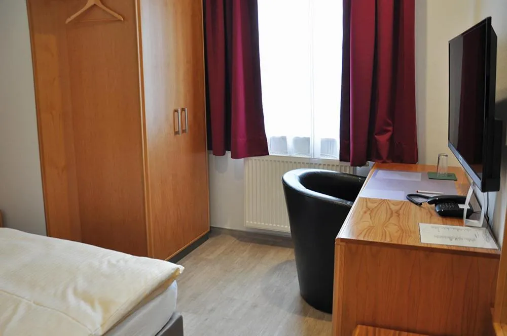 Bed in Garni Hotel Alber