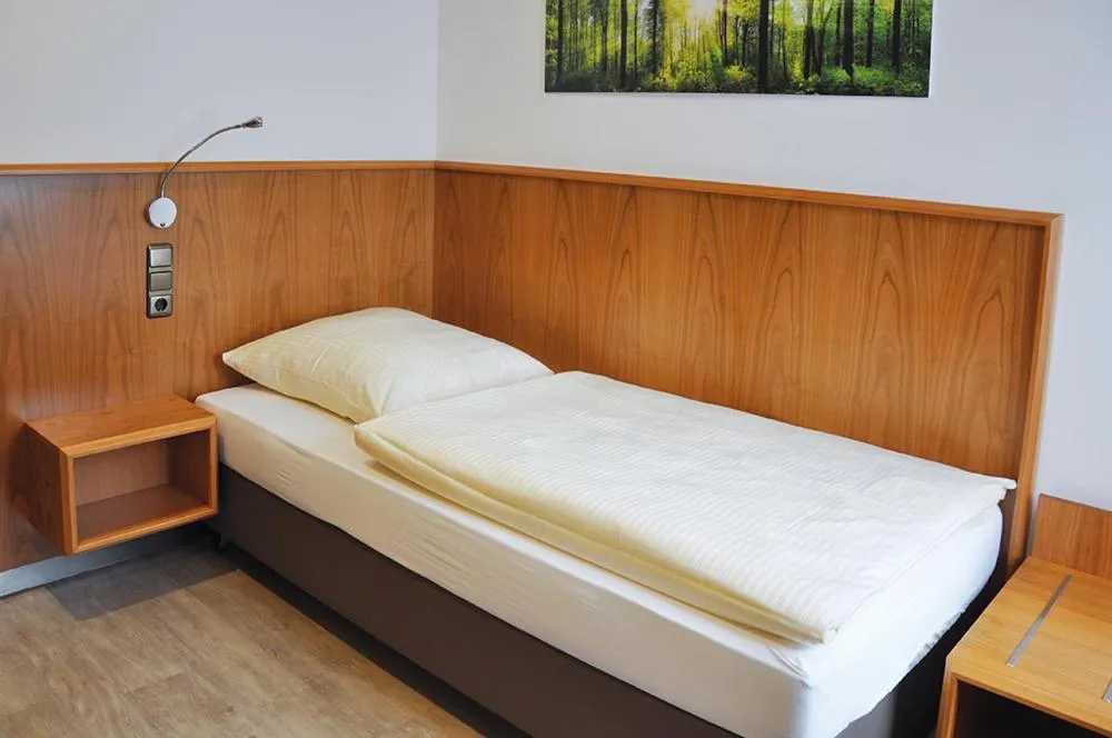 Bed in Garni Hotel Alber