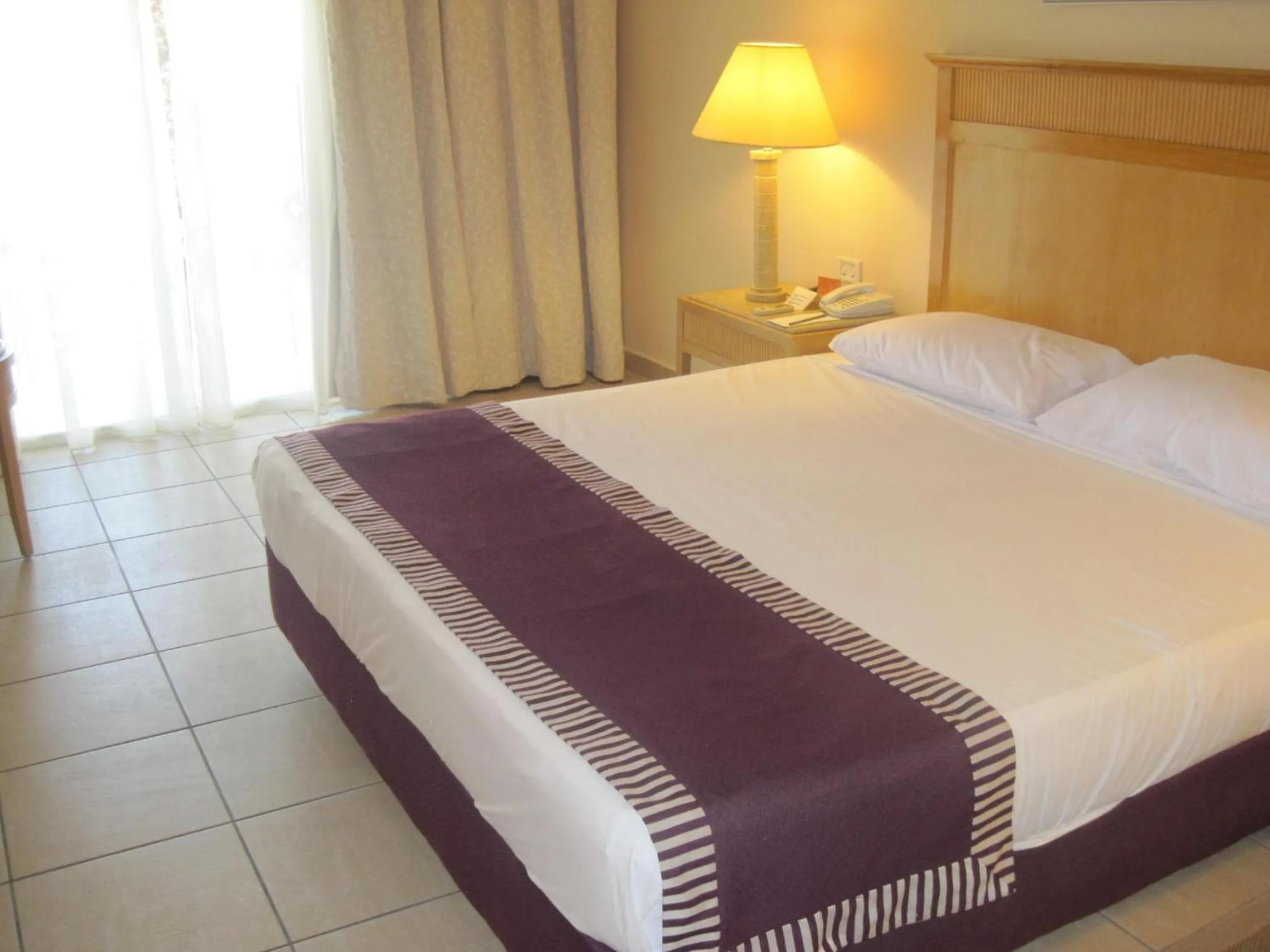 Photo of the whole room, Bed in JAZ Makadi Star & Spa