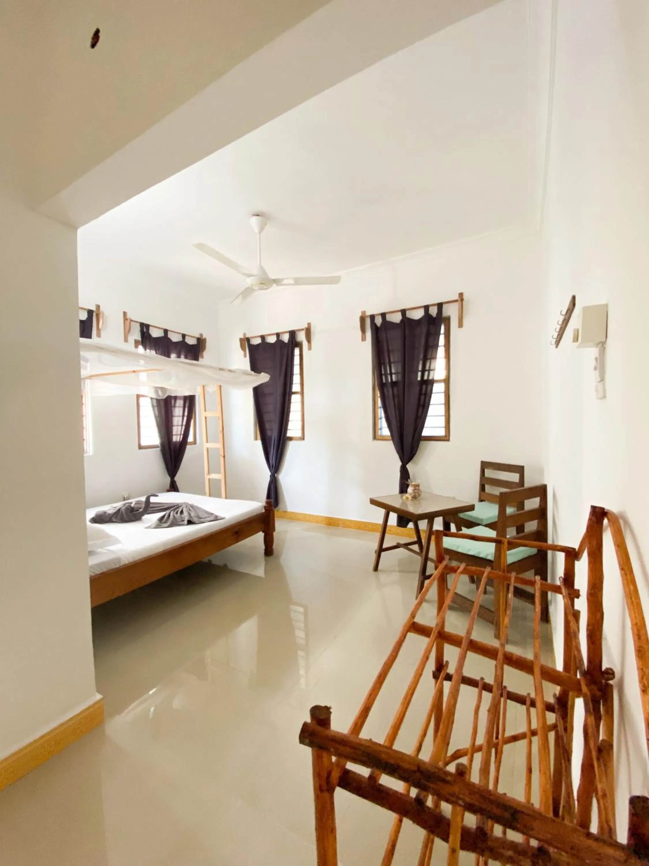 Seating area, Bed in Lighthouse Guesthouse