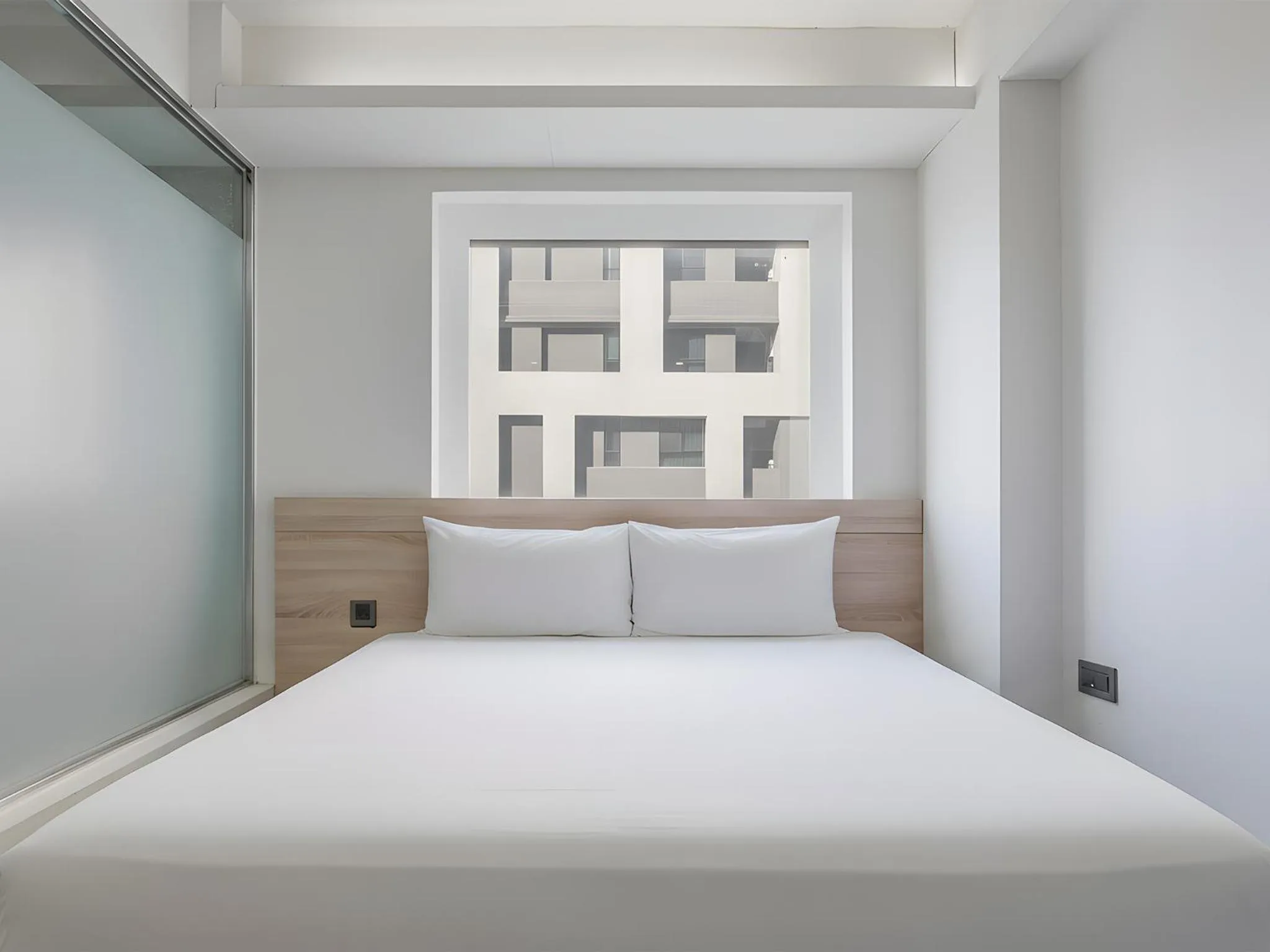 Bed in CHECK inn Taichung Liming