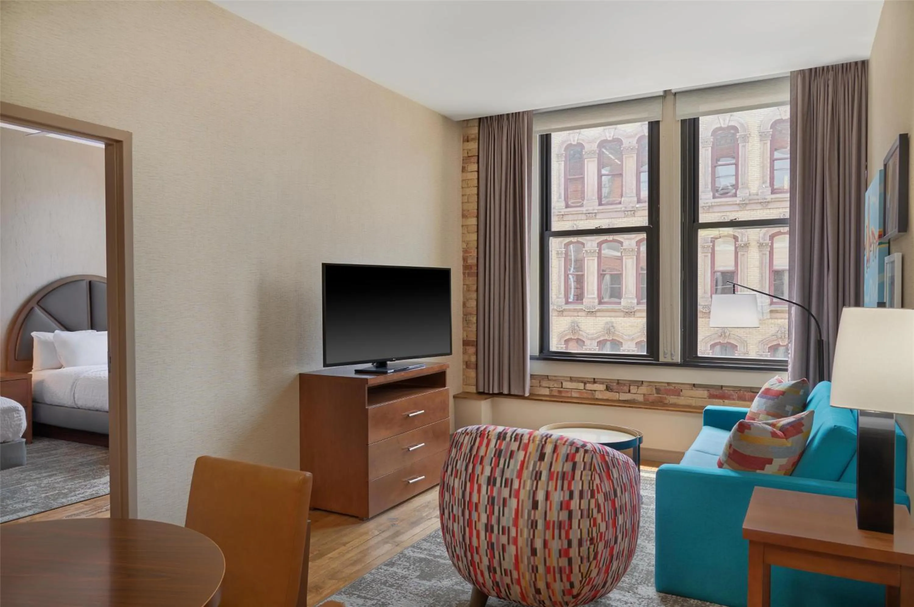 Living room, Bed in Homewood Suites by Hilton Grand Rapids Downtown