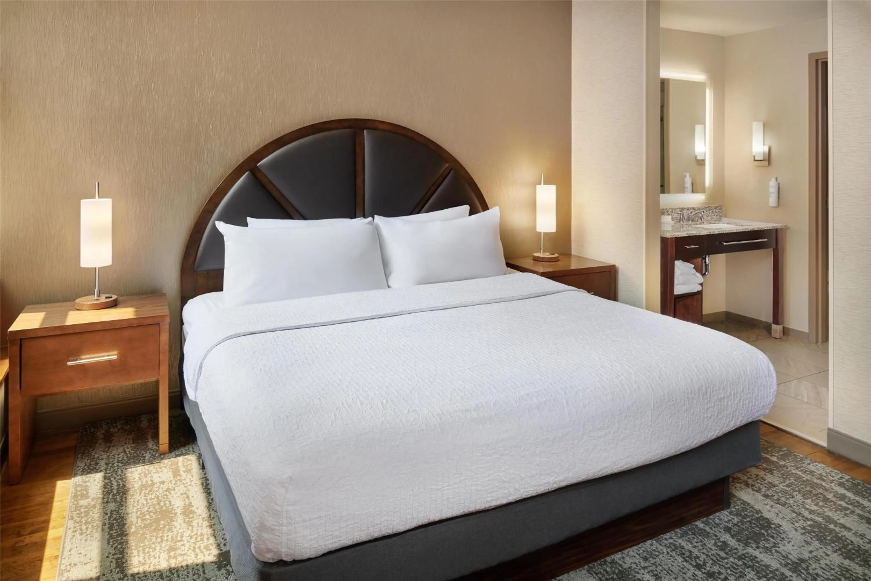 Bed in Homewood Suites by Hilton Grand Rapids Downtown