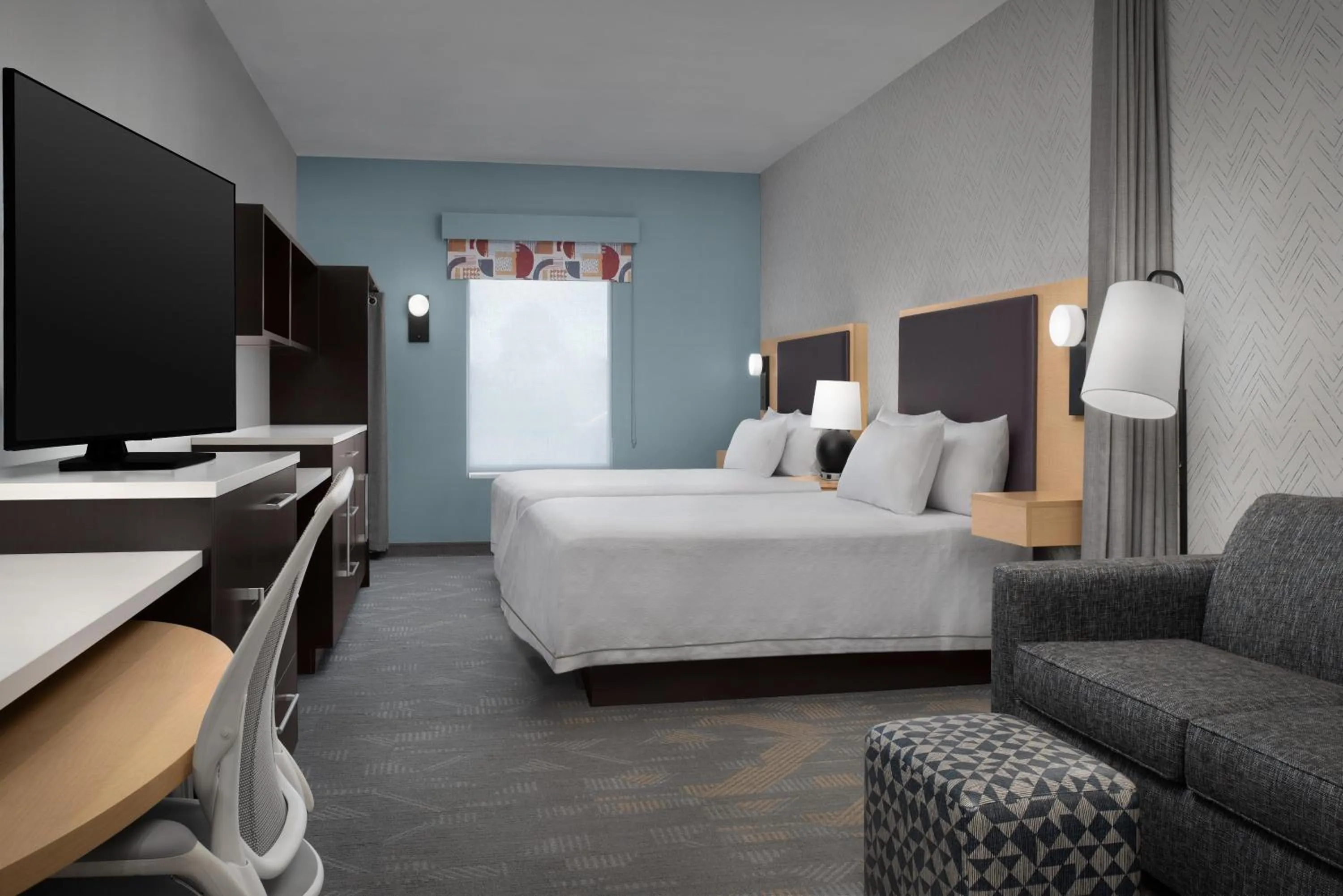 Living room, Bed in Home2 Suites by Hilton Lake City