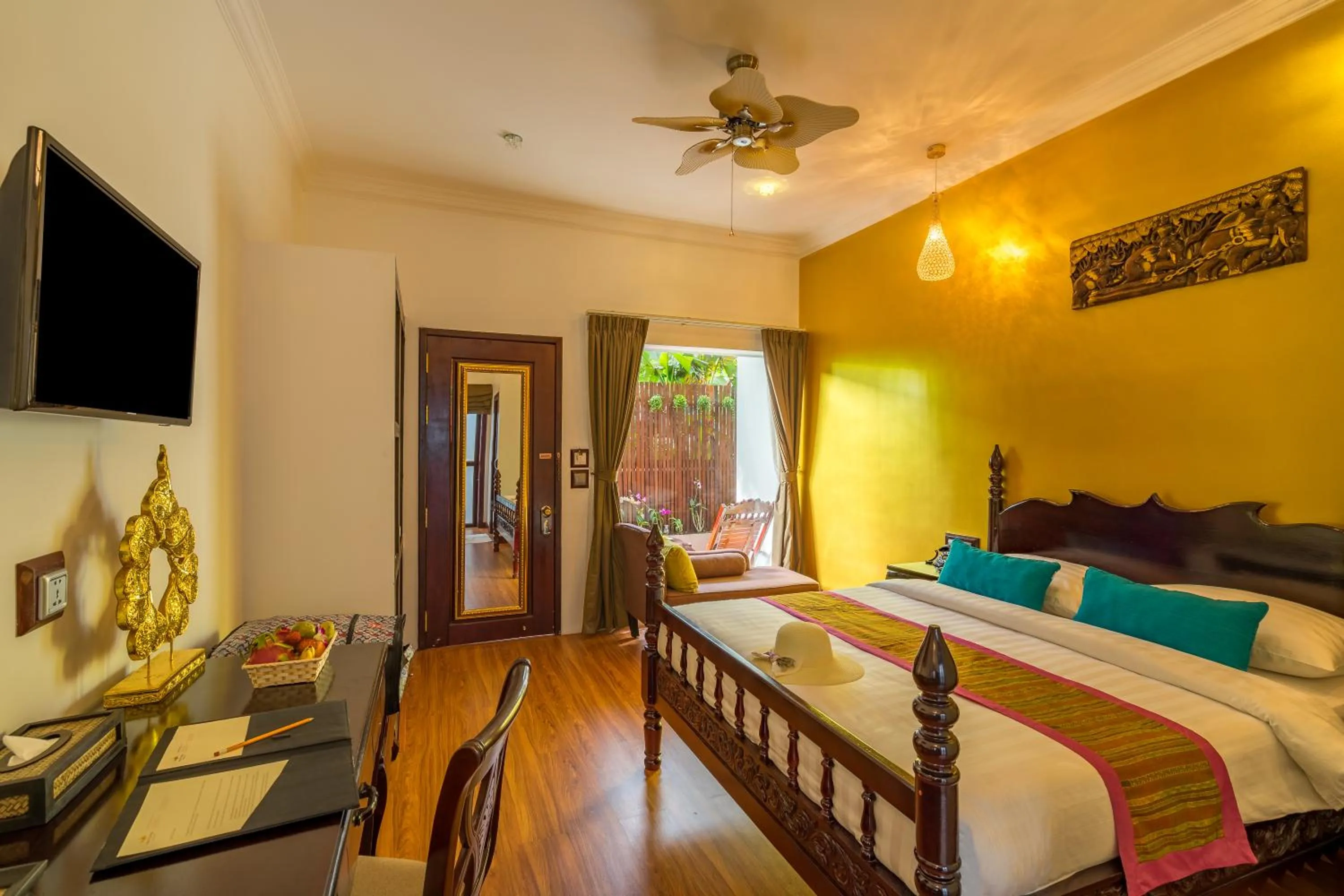 Seating area, Bed in Beyond Yangon Inn