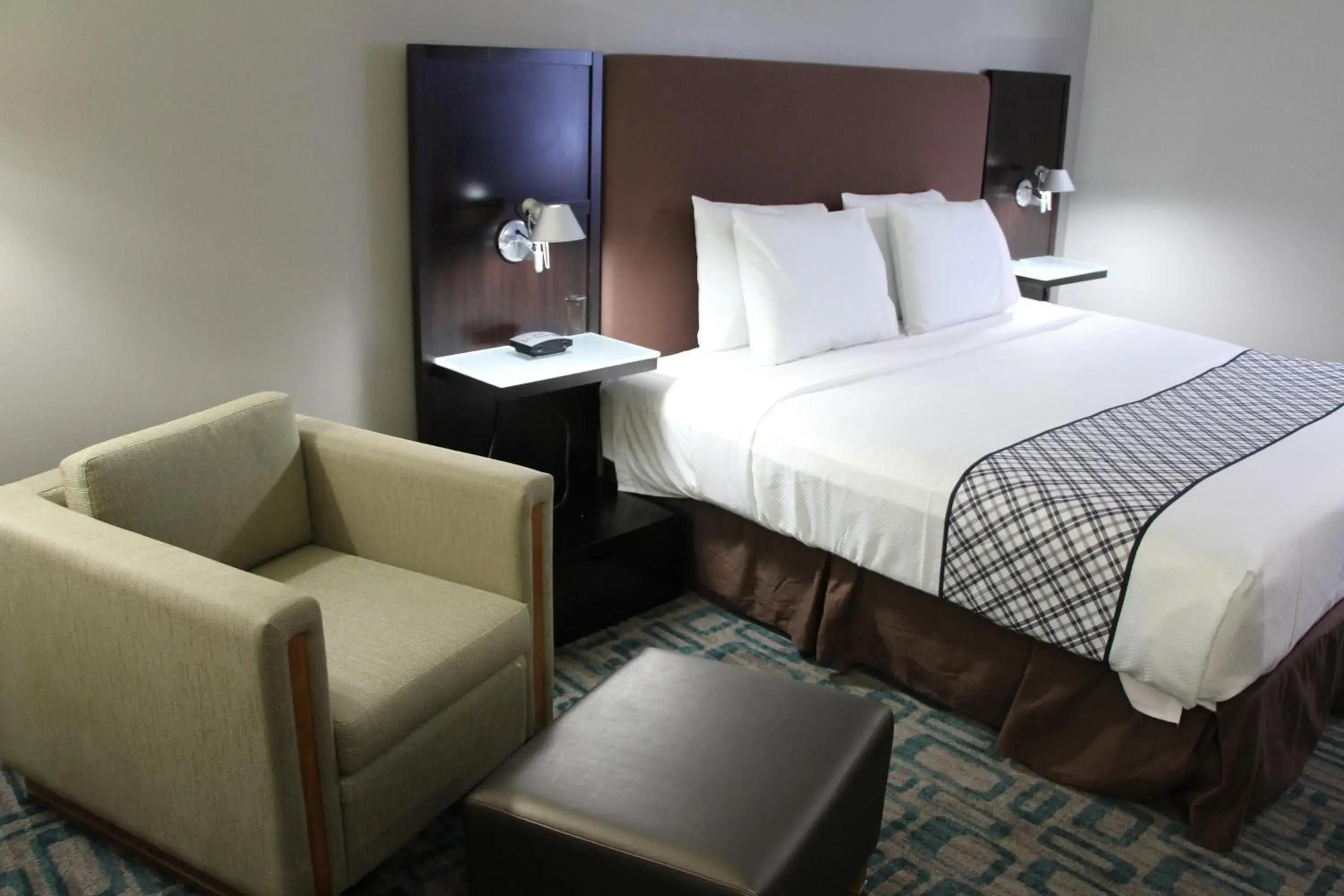 Bed in Westbridge Inn & Suites Bed in Westbridge Inn & Suites