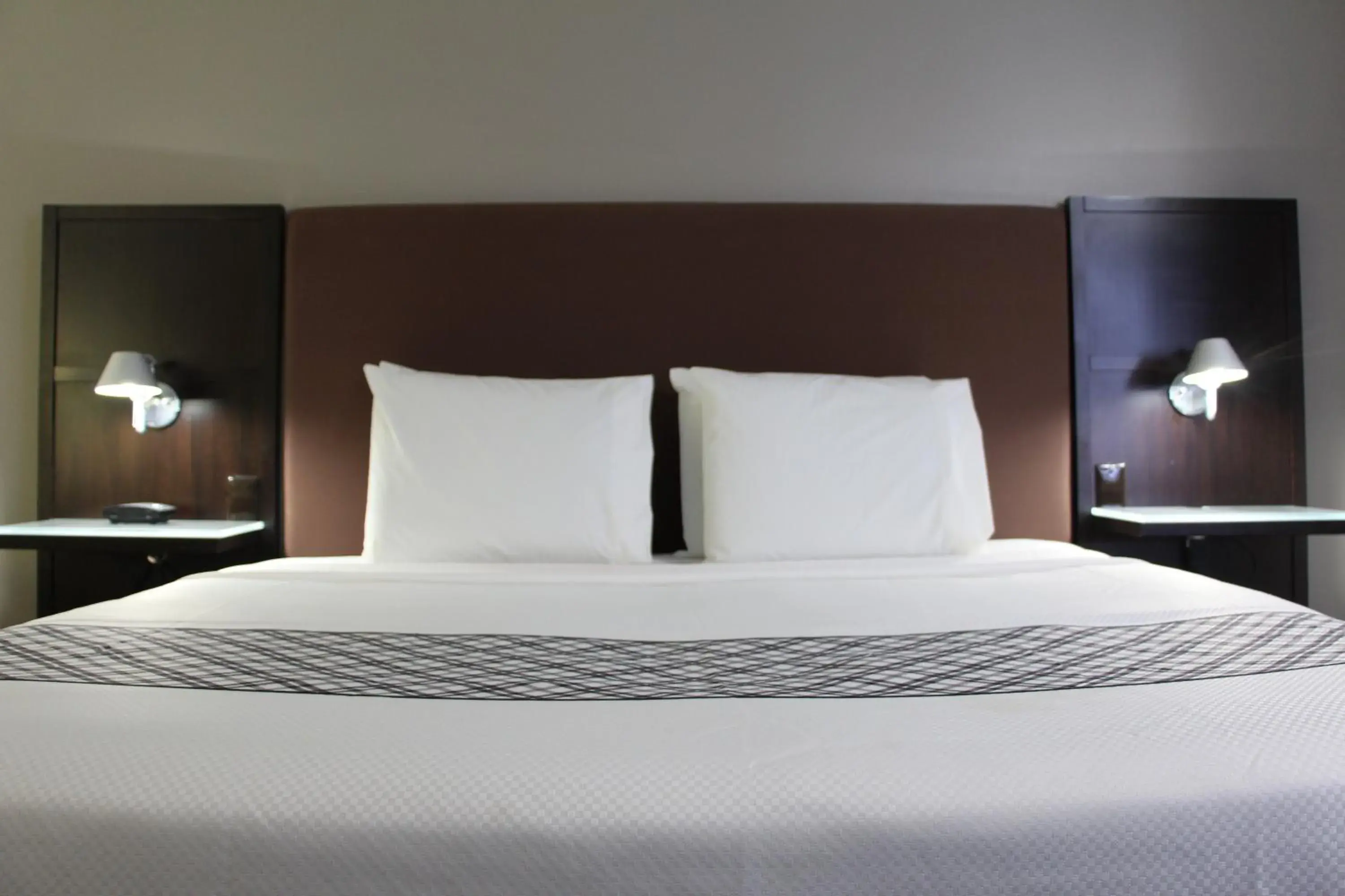 Bed in Westbridge Inn & Suites Bed in Westbridge Inn & Suites