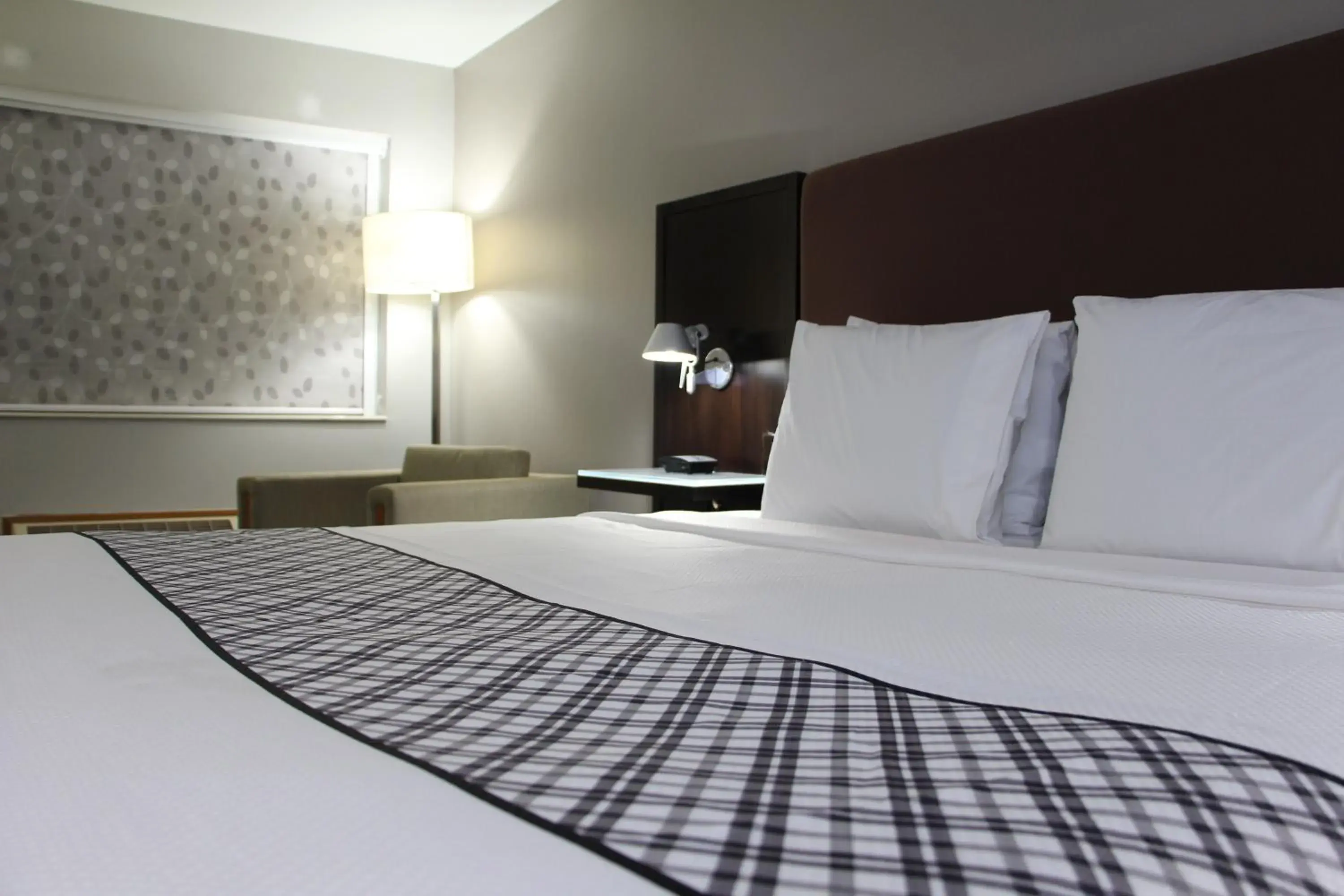 Bed in Westbridge Inn & Suites Bed in Westbridge Inn & Suites