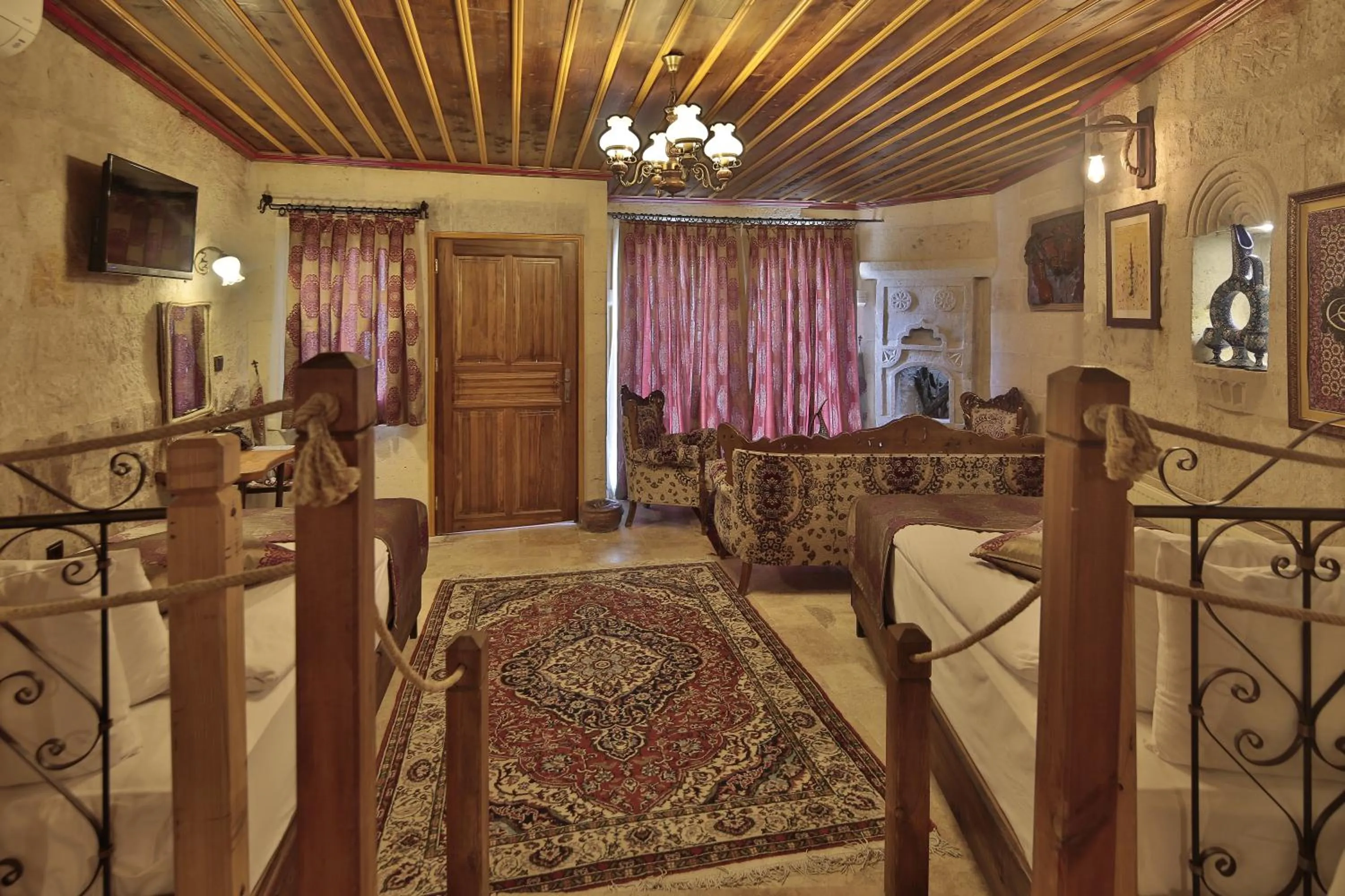 Seating area, Bed in Aren Cave Hotel And Art Gallery