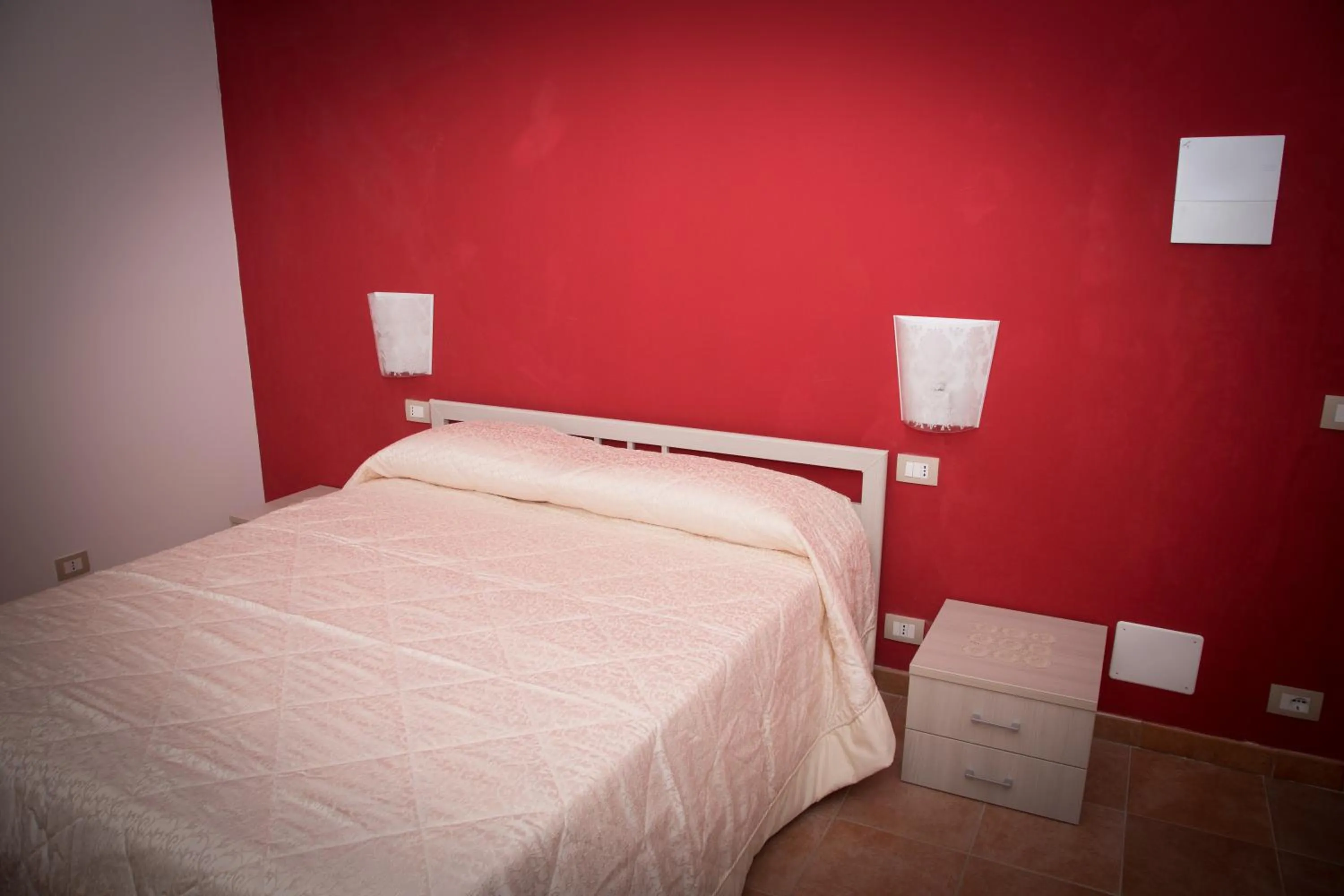 Bed in Modica Garden Resort