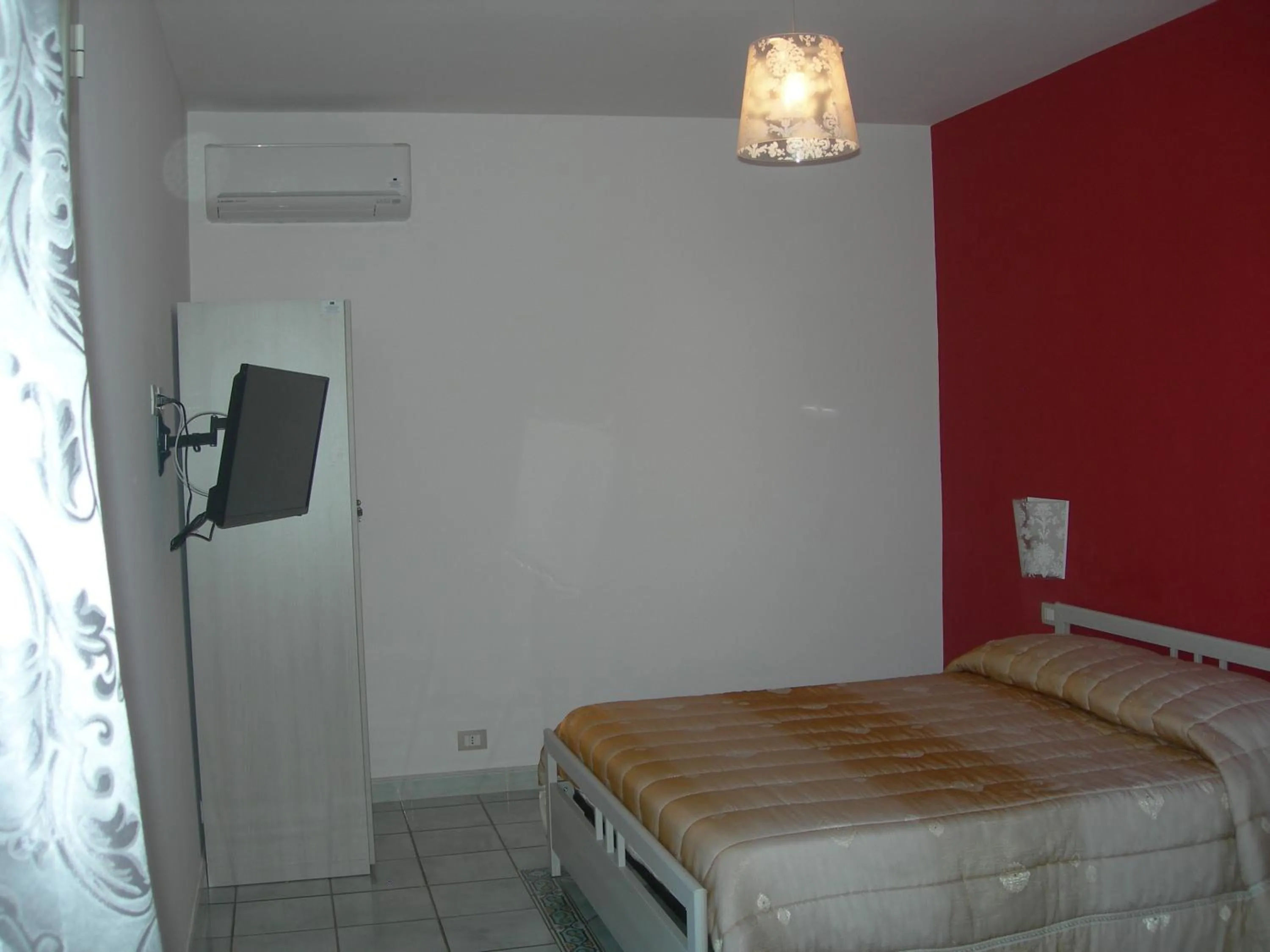 Bed in Modica Garden Resort