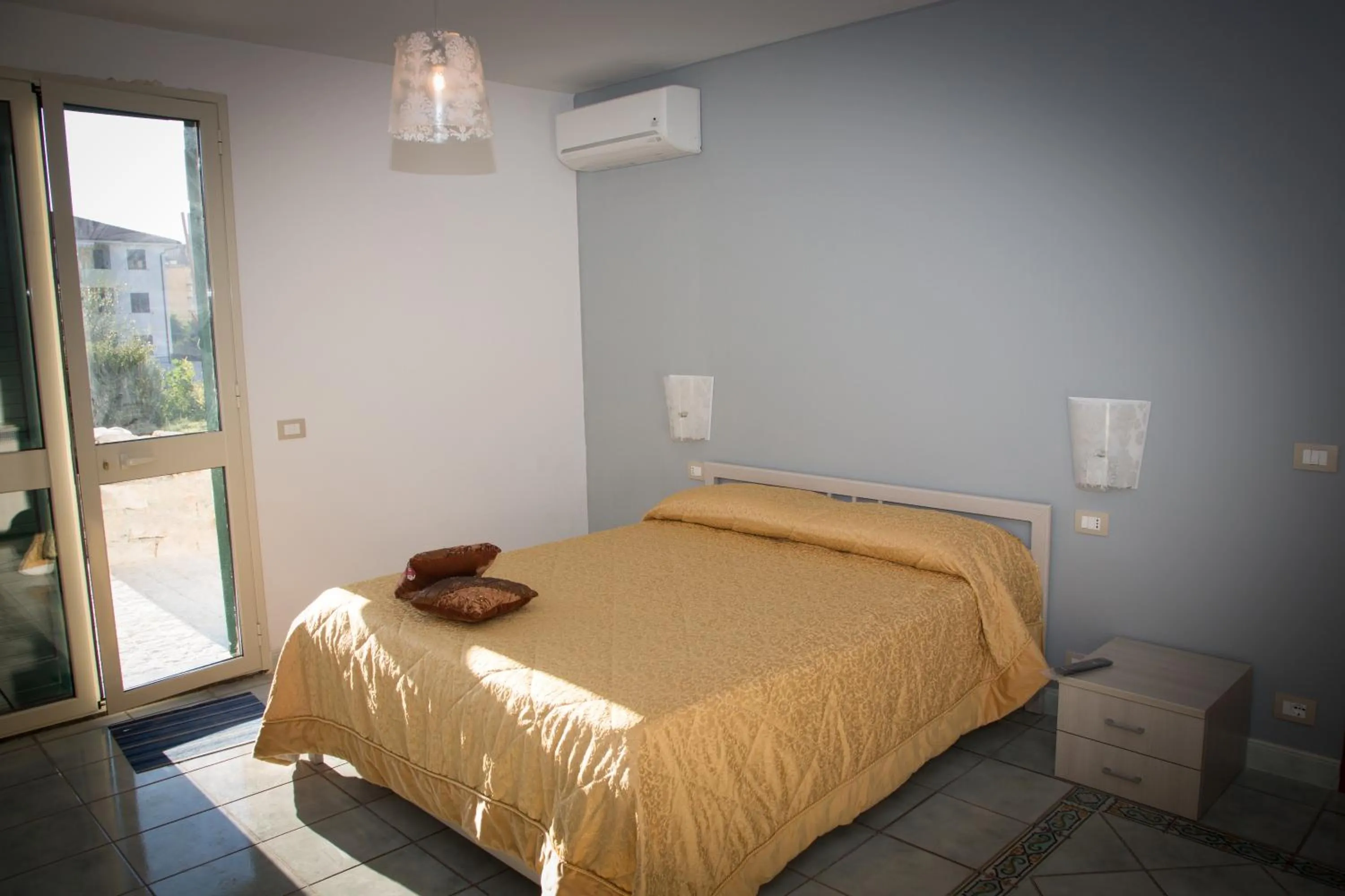 Bed in Modica Garden Resort