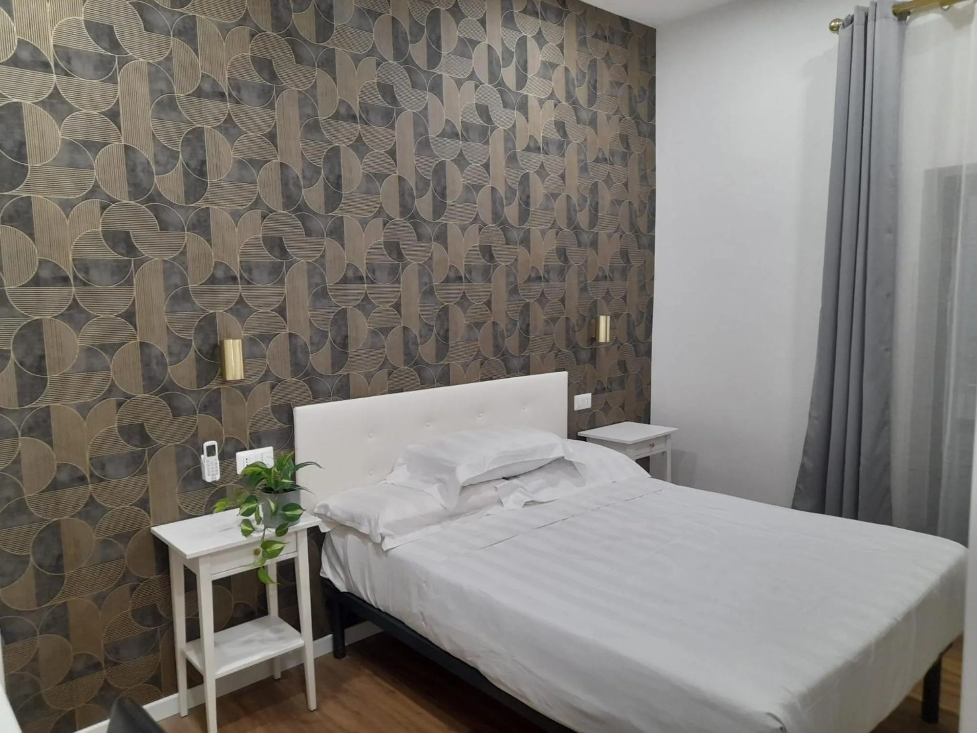 Bed in Amalia Suites by Remember Rome