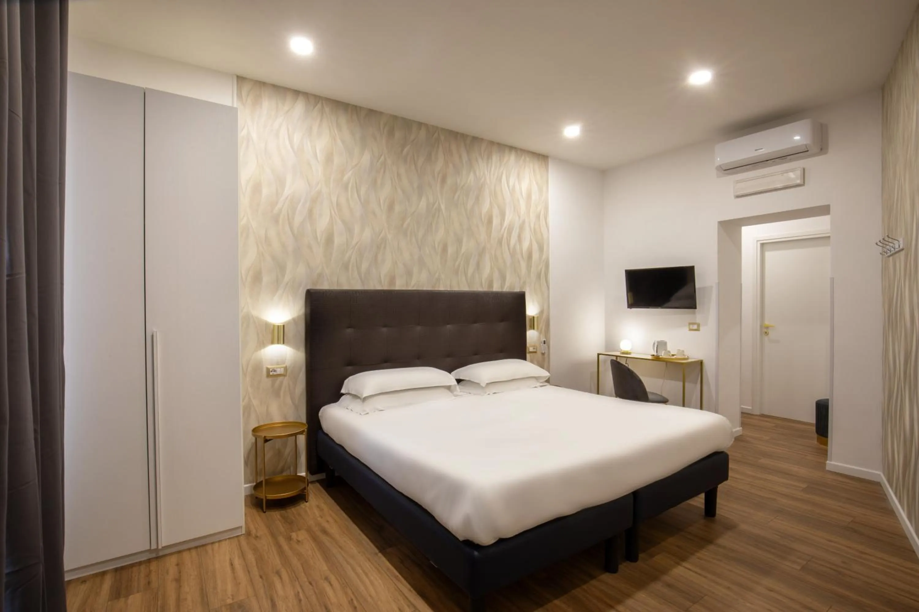 Bed in Amalia Suites by Remember Rome