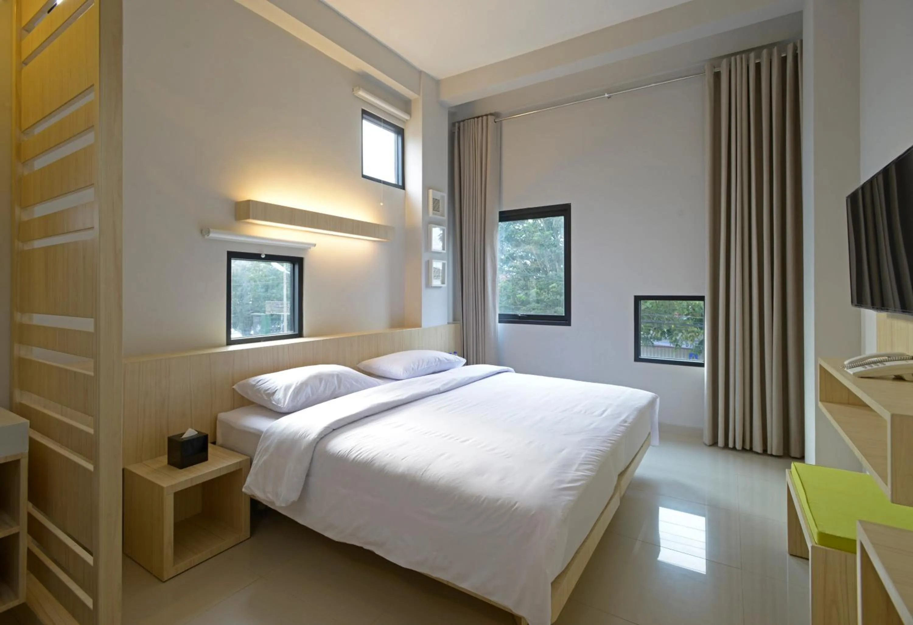 Bed in Arjuna Hotel Batu City