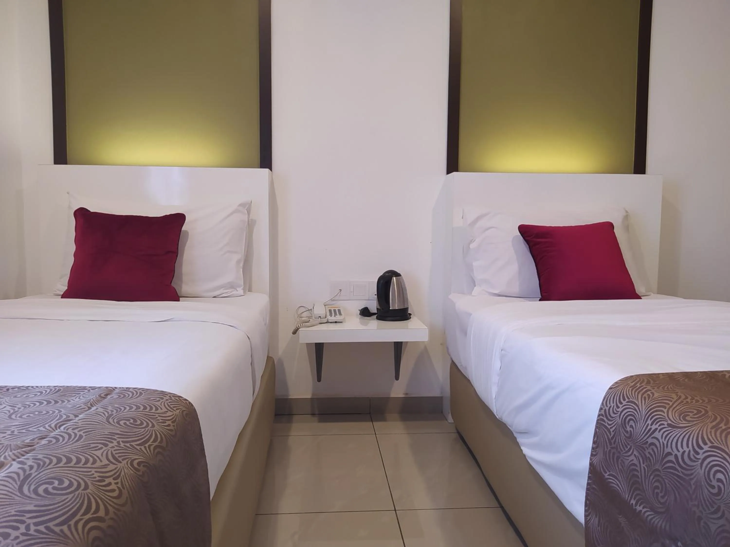 Bed in Crescendo Boutique Hotel