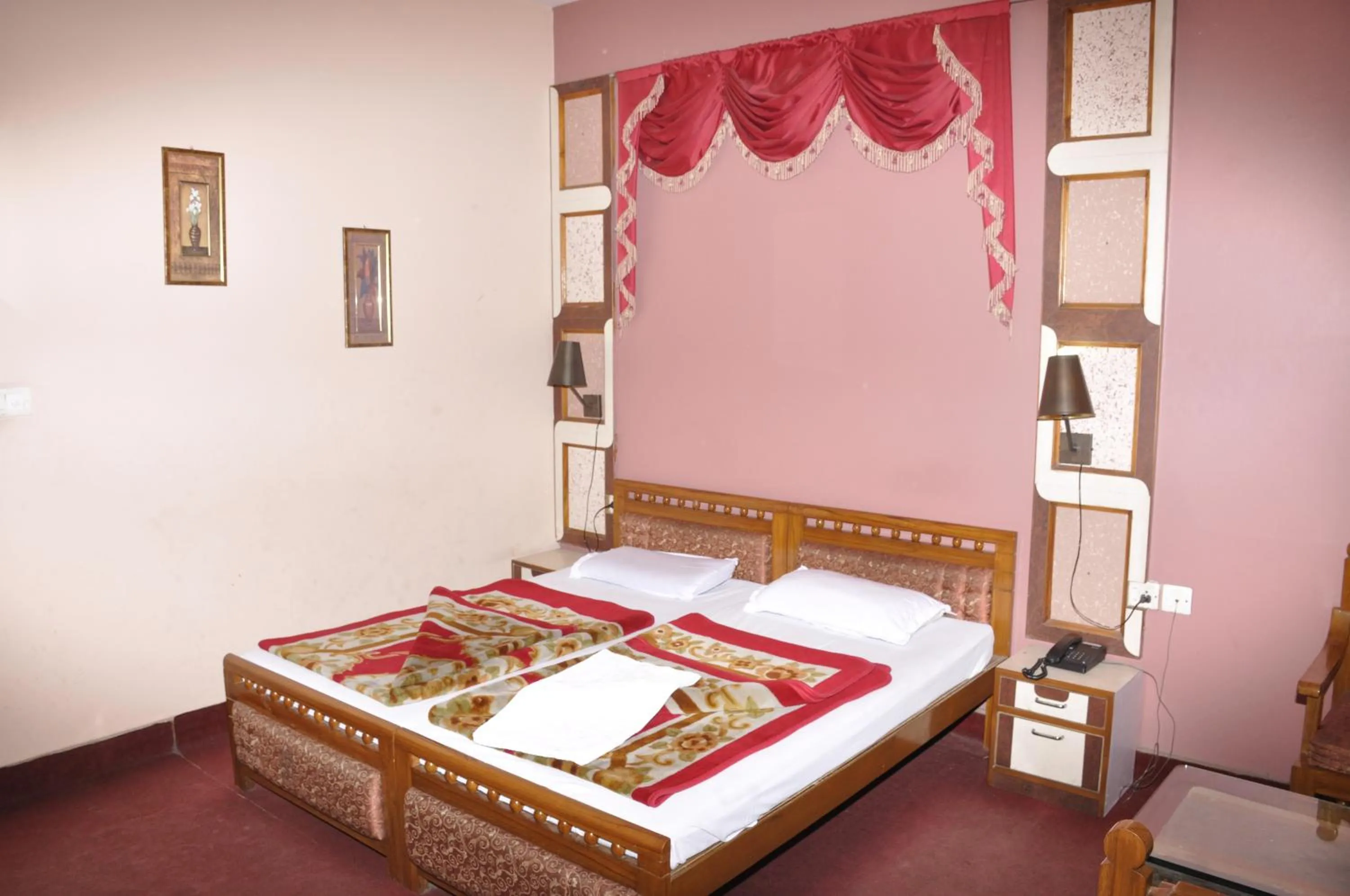 Bed in Hotel Pratiksha
