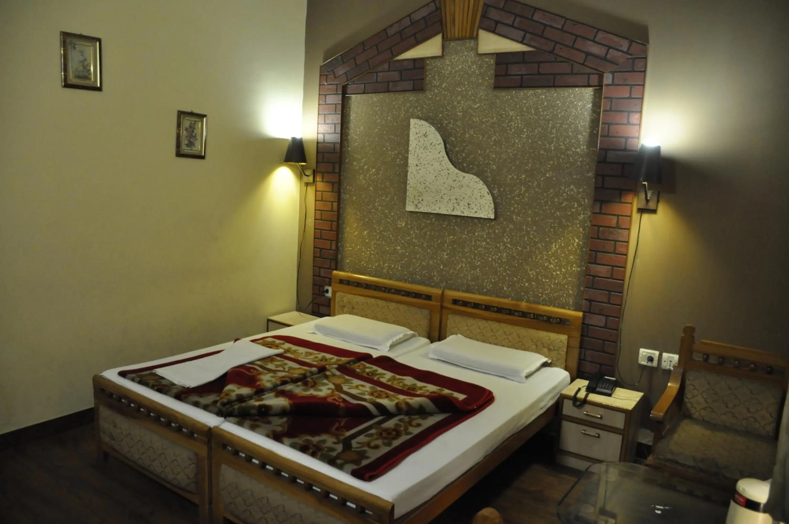 Bed in Hotel Pratiksha