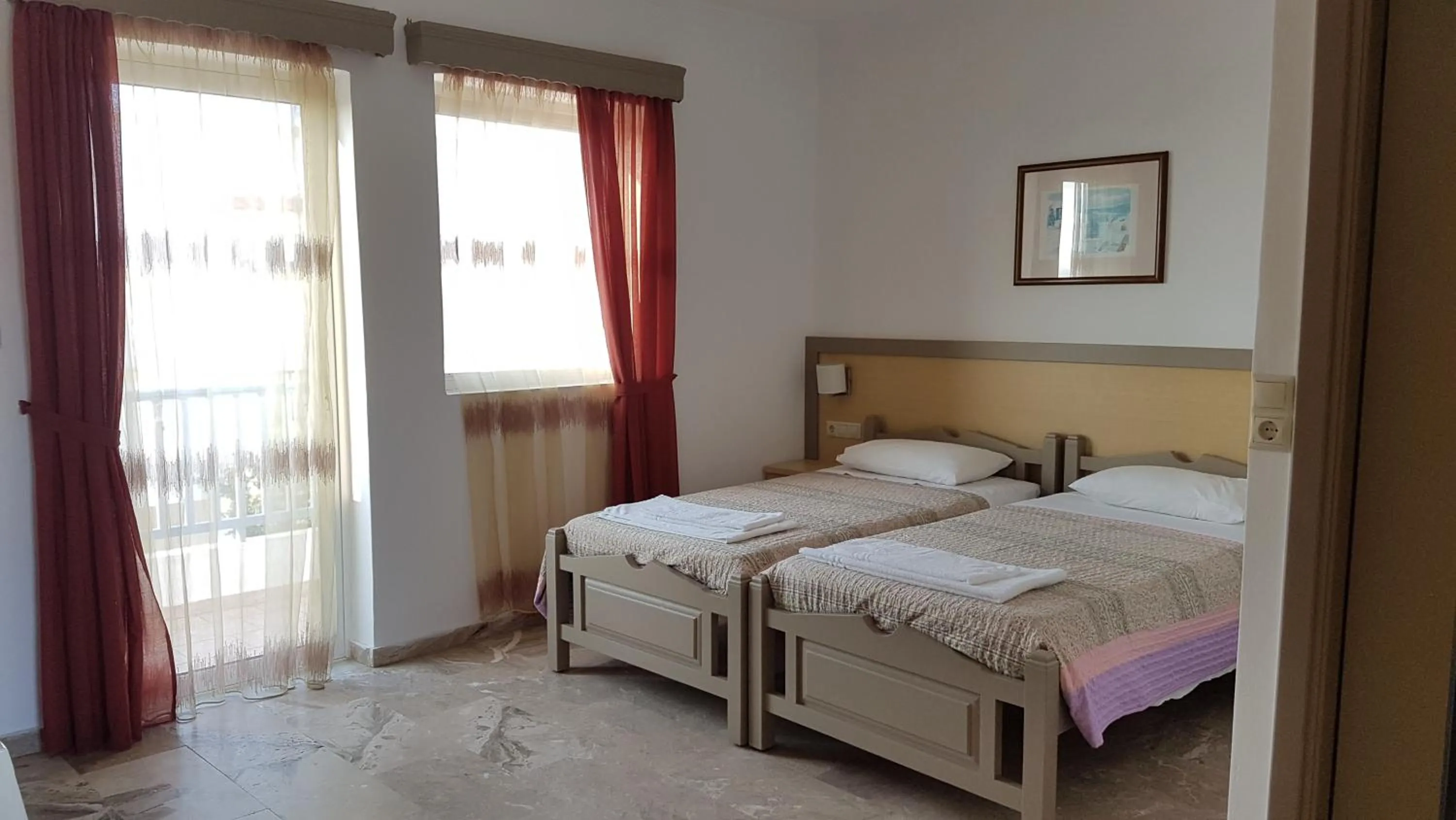 Bed in Luis Apartments