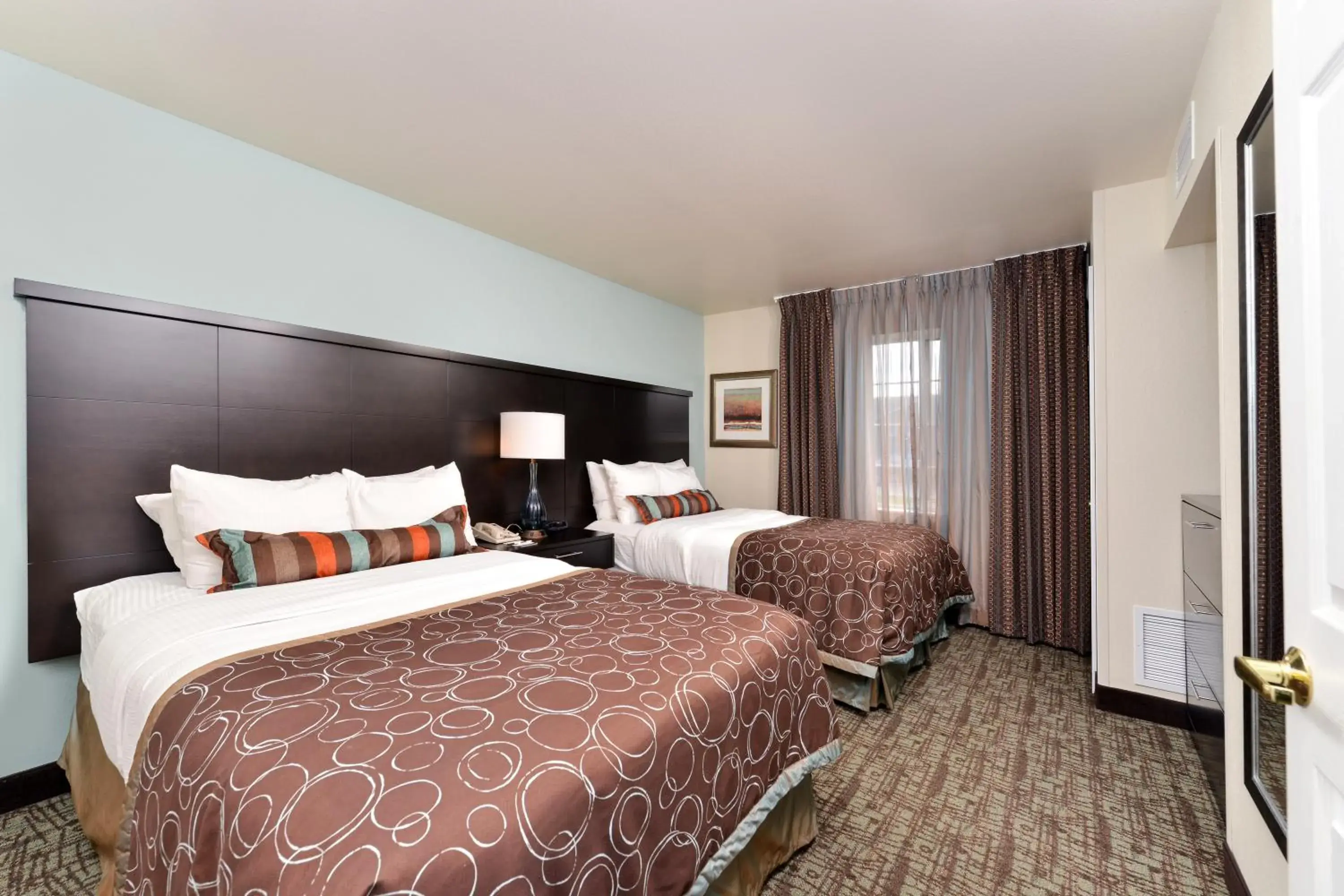 Bed in Staybridge Suites Sioux Falls at Empire Mall by IHG Bed in Staybridge Suites Sioux Falls at Empire Mall by IHG
