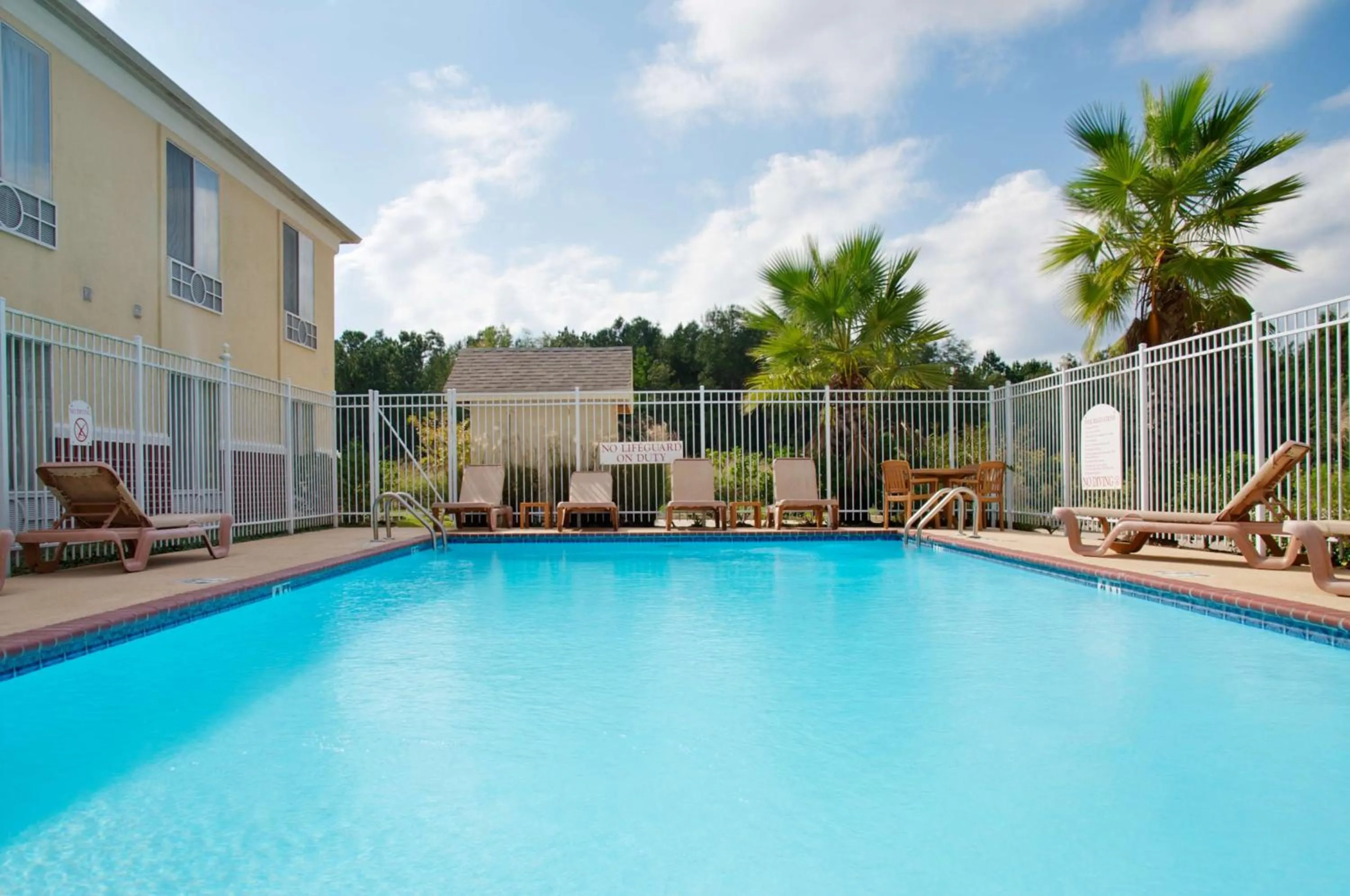 Pool view in Express Inn Leesville Ft Johnson, SureStay Collection by Best Western