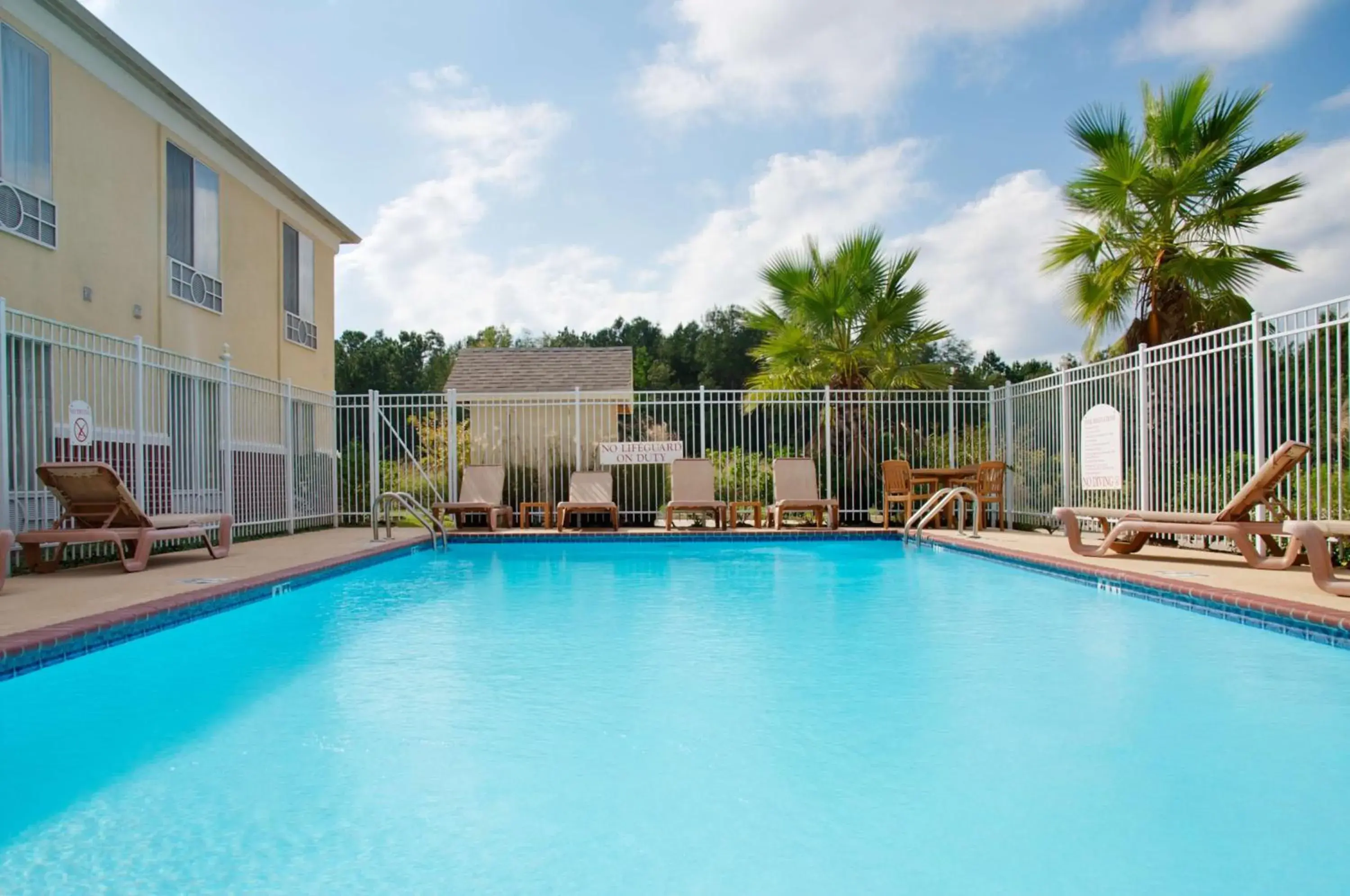 Pool view in Express Inn Leesville Ft Johnson, SureStay Collection by Best Western Pool view in Express Inn Leesville Ft Johnson, SureStay Collection by Best Western