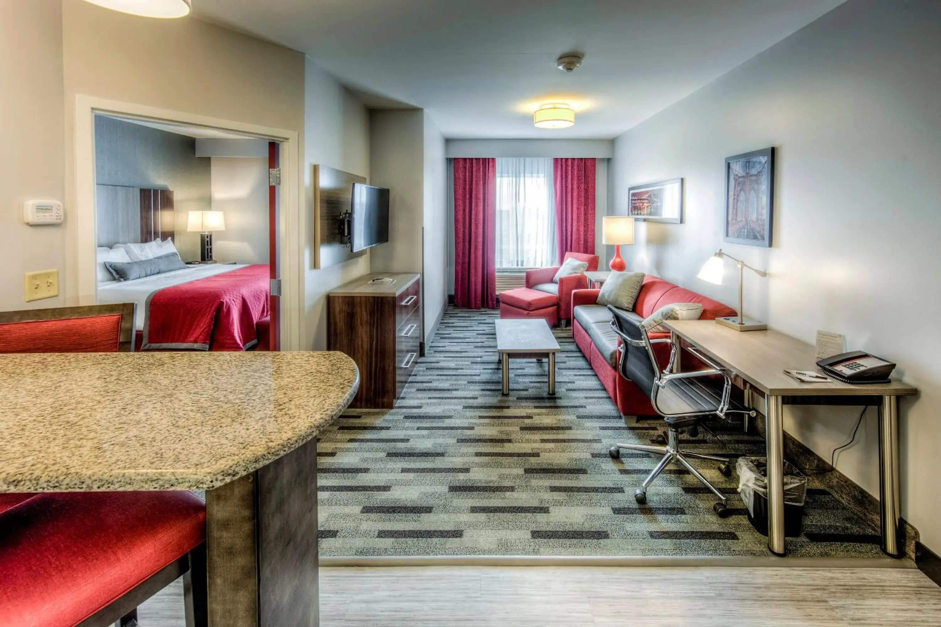 Living room, Bed in Staybridge Suites - University Area OSU by IHG Living room, Bed in Staybridge Suites - University Area OSU by IHG