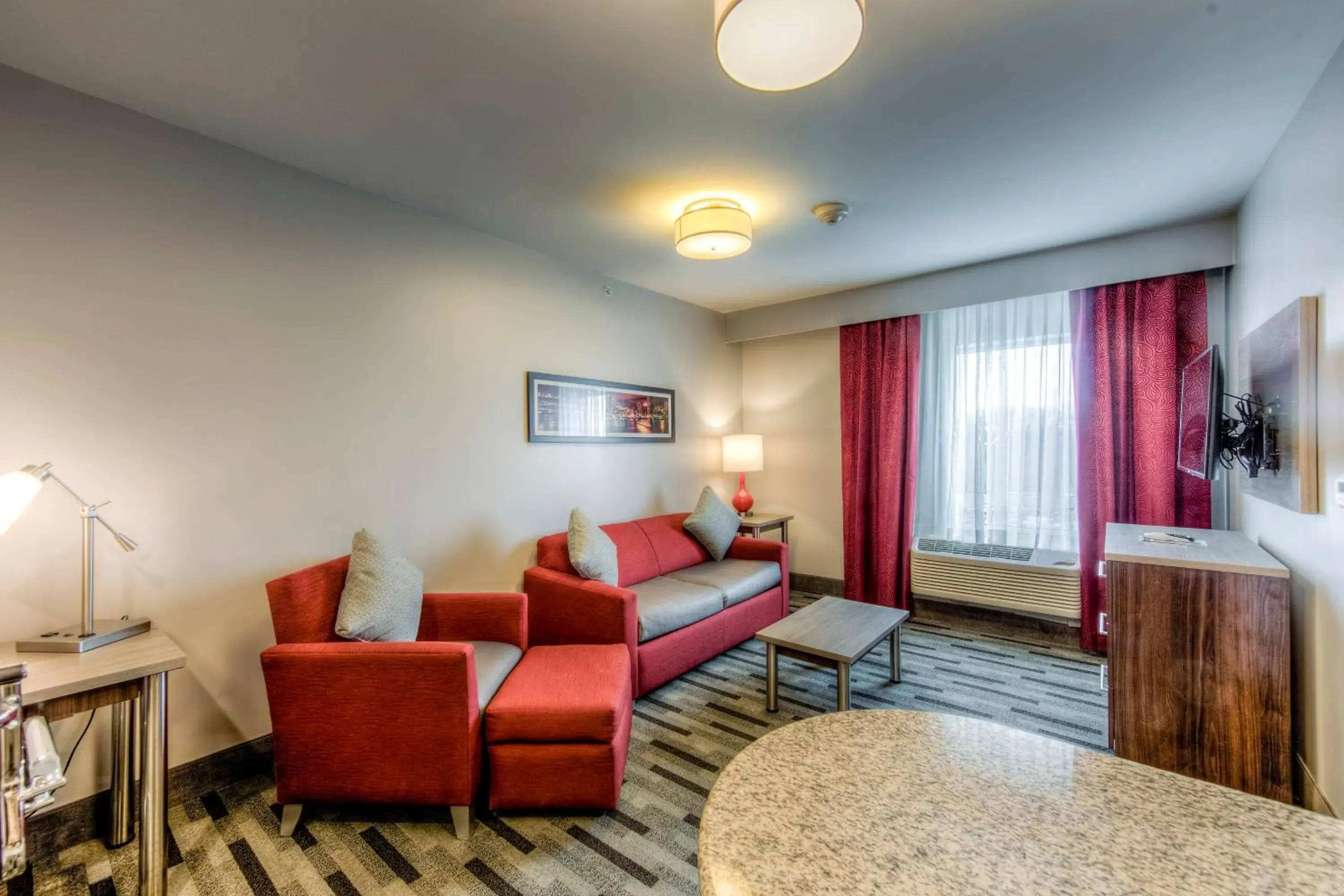 Living room in Staybridge Suites - University Area OSU by IHG Living room in Staybridge Suites - University Area OSU by IHG