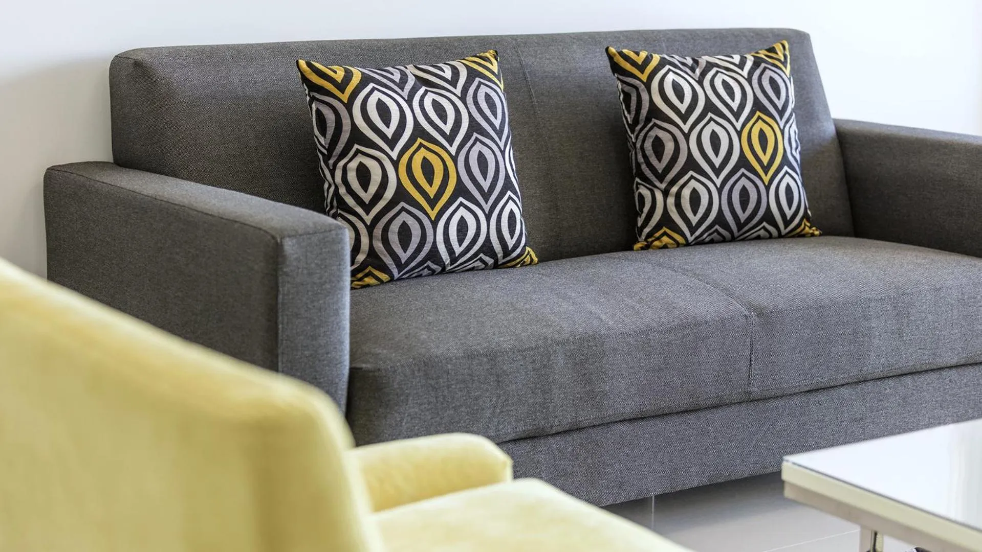 Seating area in Oaks Brisbane Woolloongabba Suites