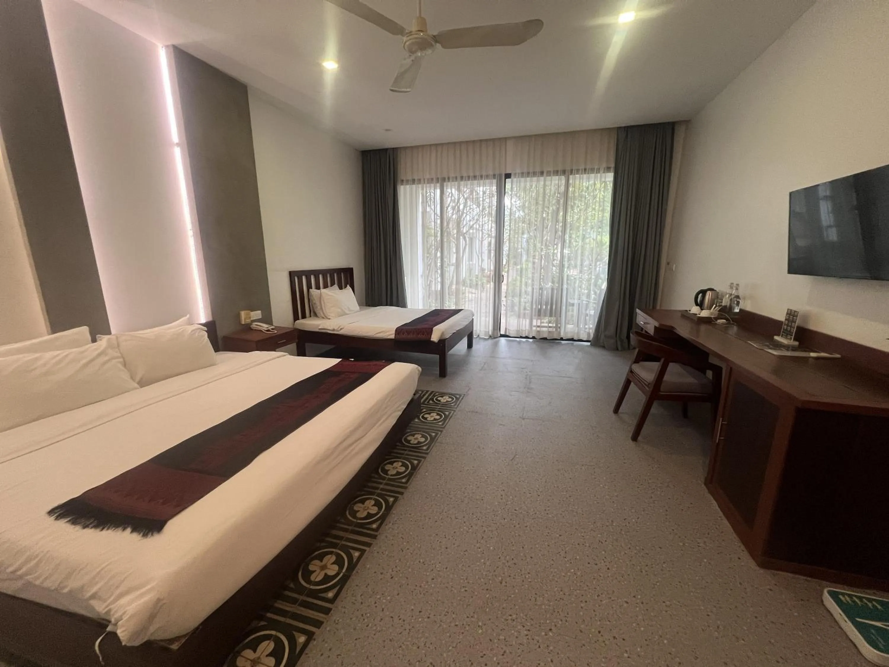 Bed in Tanei Angkor Resort and Spa