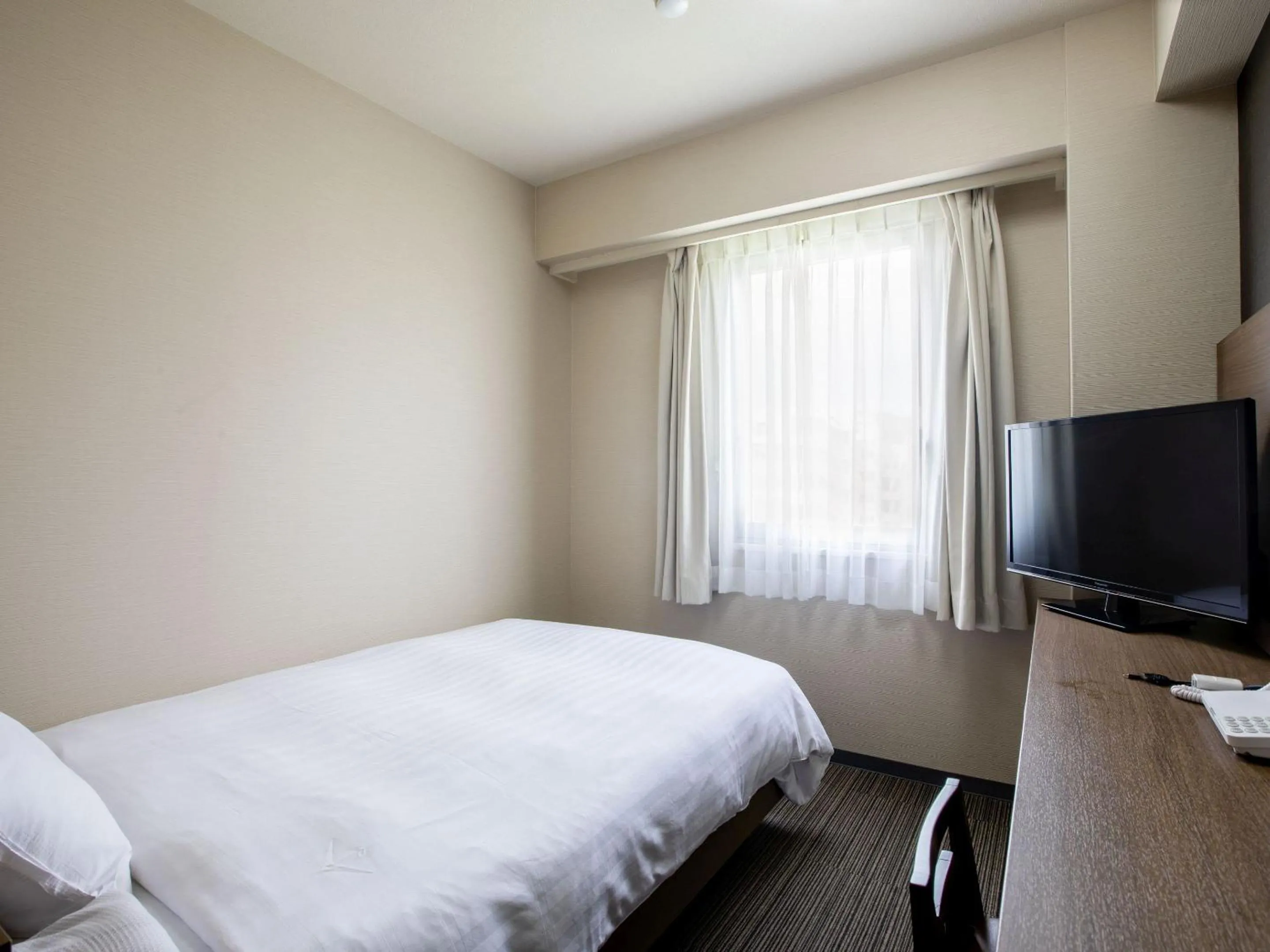 Bed in KOKO STAY Hitachi- formerly Hotel Wing International Hitachi