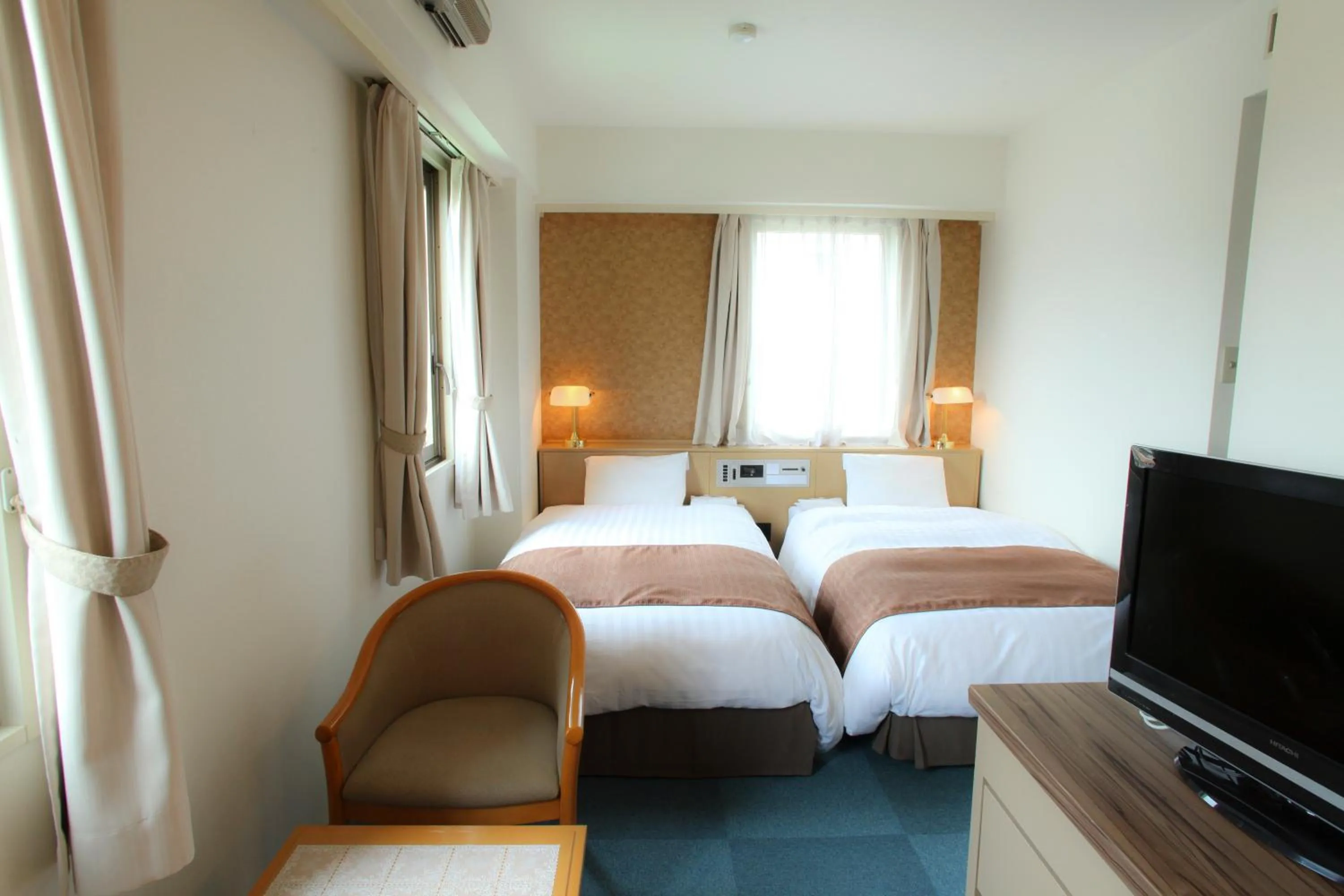 Photo of the whole room, Bed in Hotel Wing International Hitachi