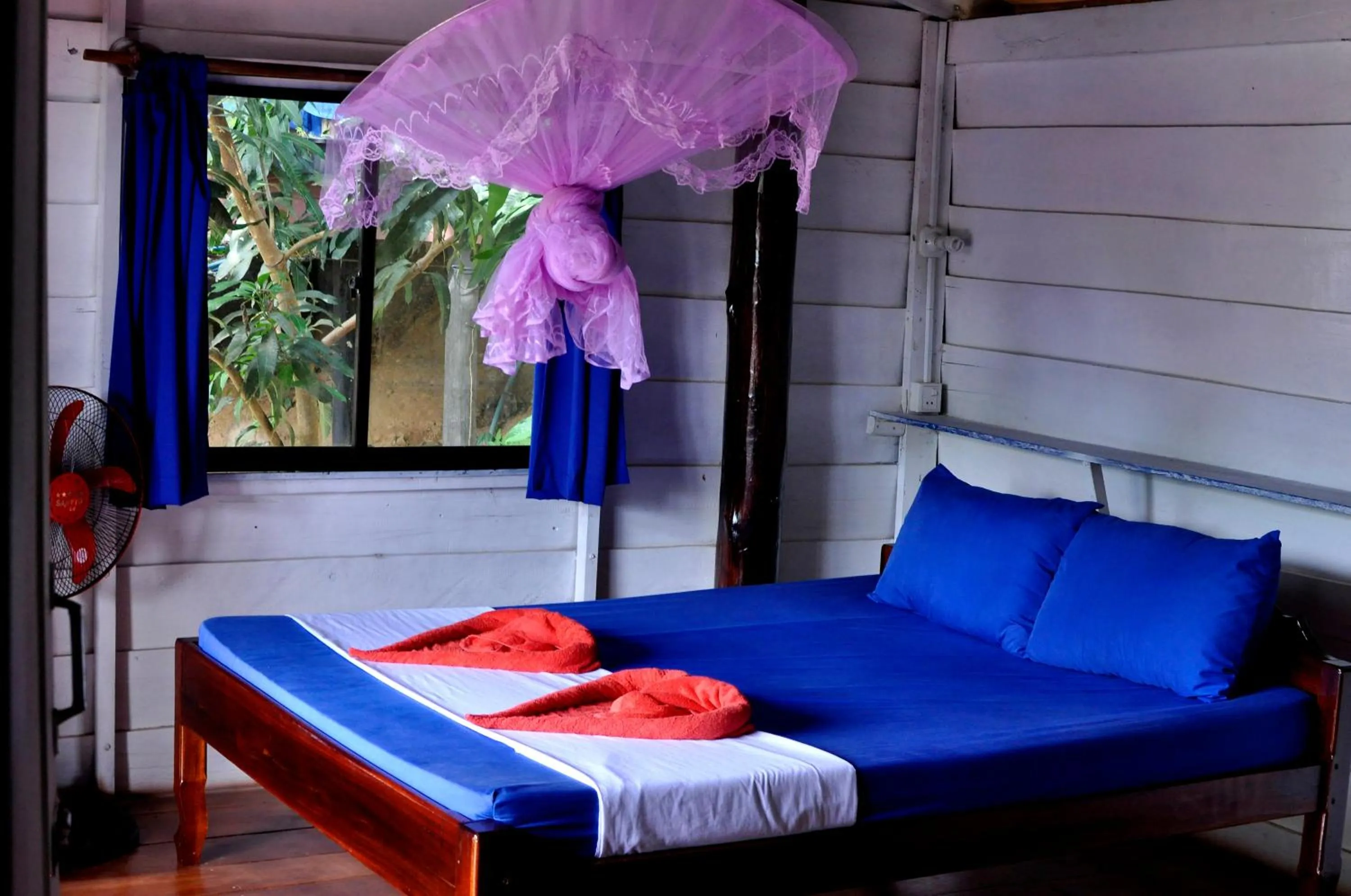 Bed in Happy Elephant Bungalows