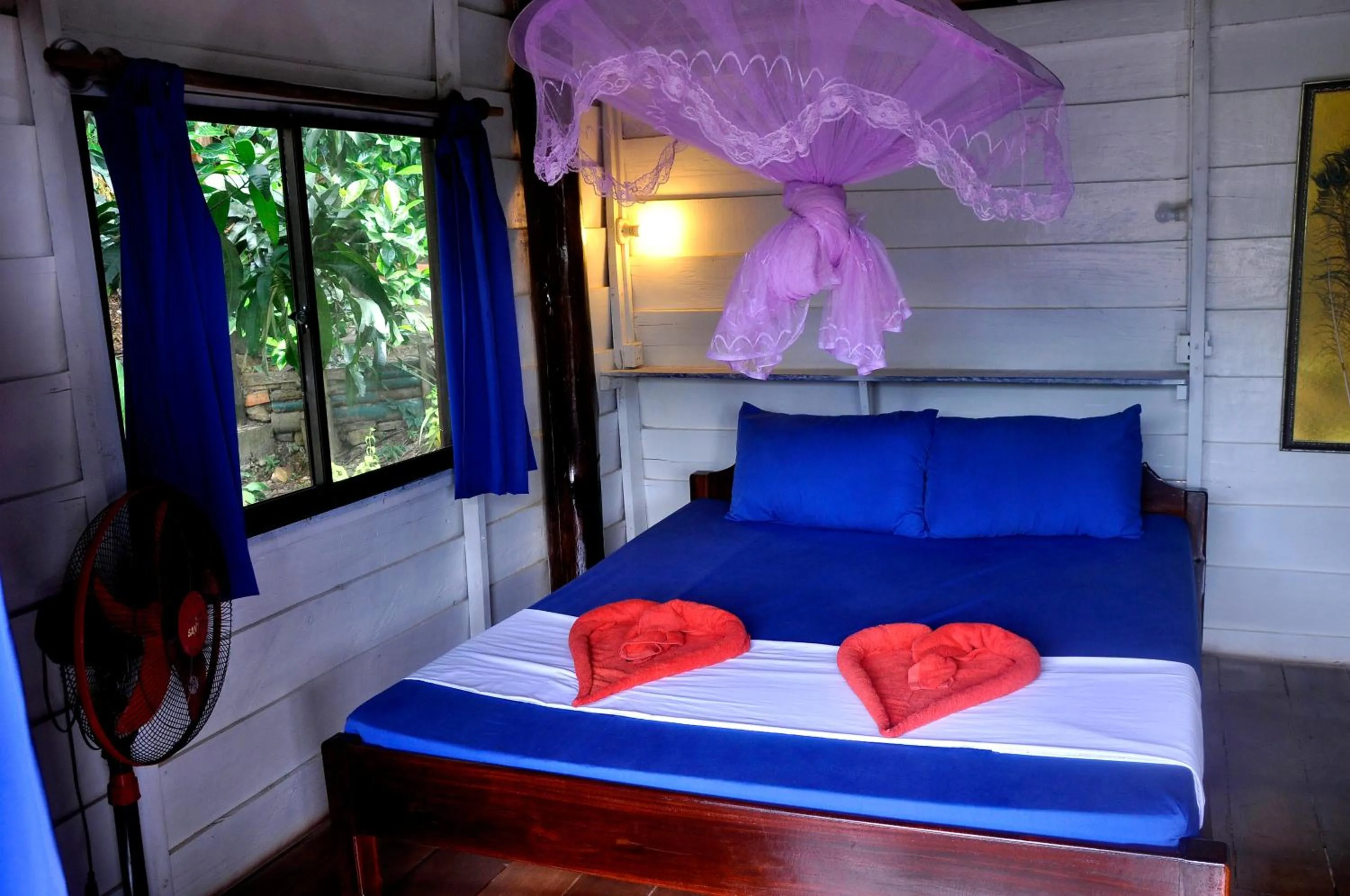 Bed in Happy Elephant Bungalows