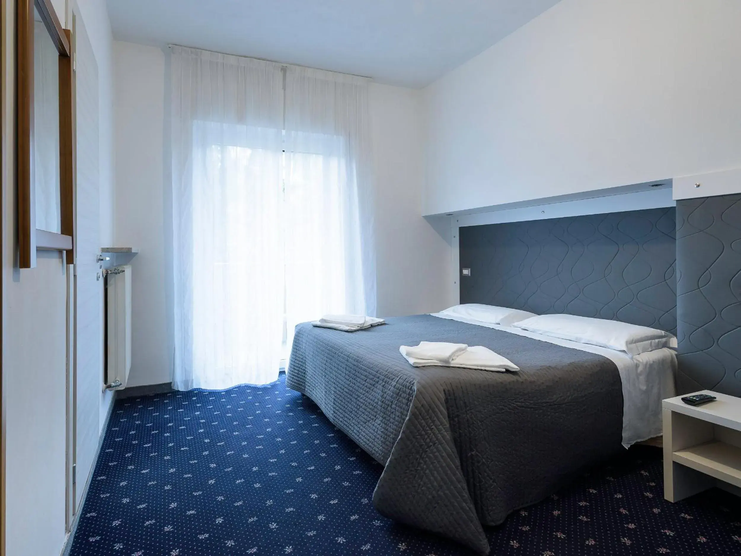 Bed in Hotel Rubino Bed in Hotel Rubino