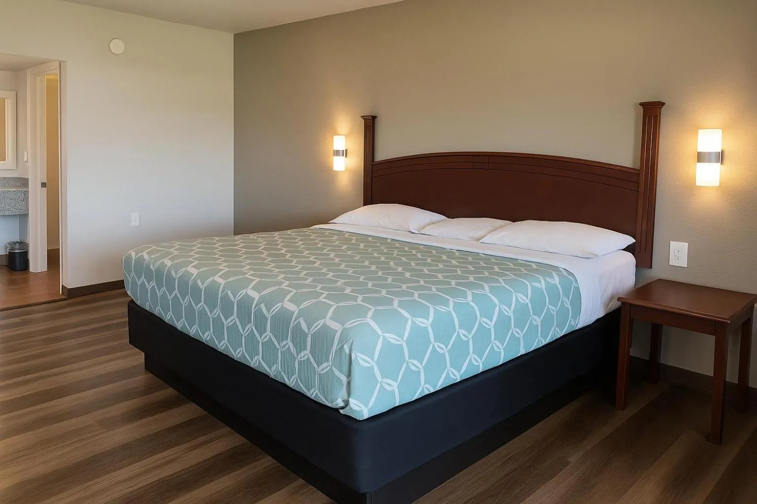 Bed in American Inn & Suites