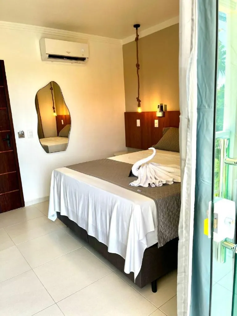 Bed in Pousada Concha Dourada