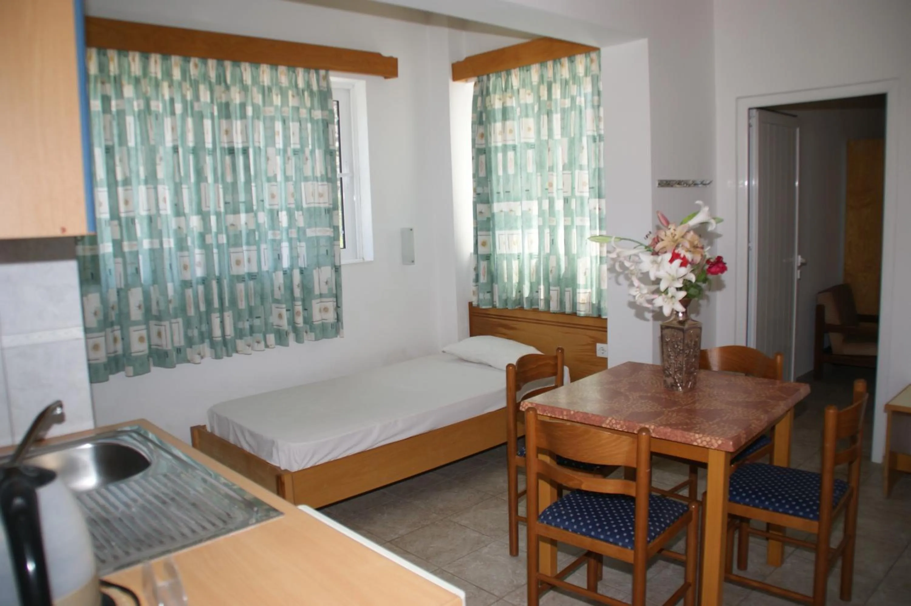 Dining area, Bed in Faliraki Dream Studios & Apartments