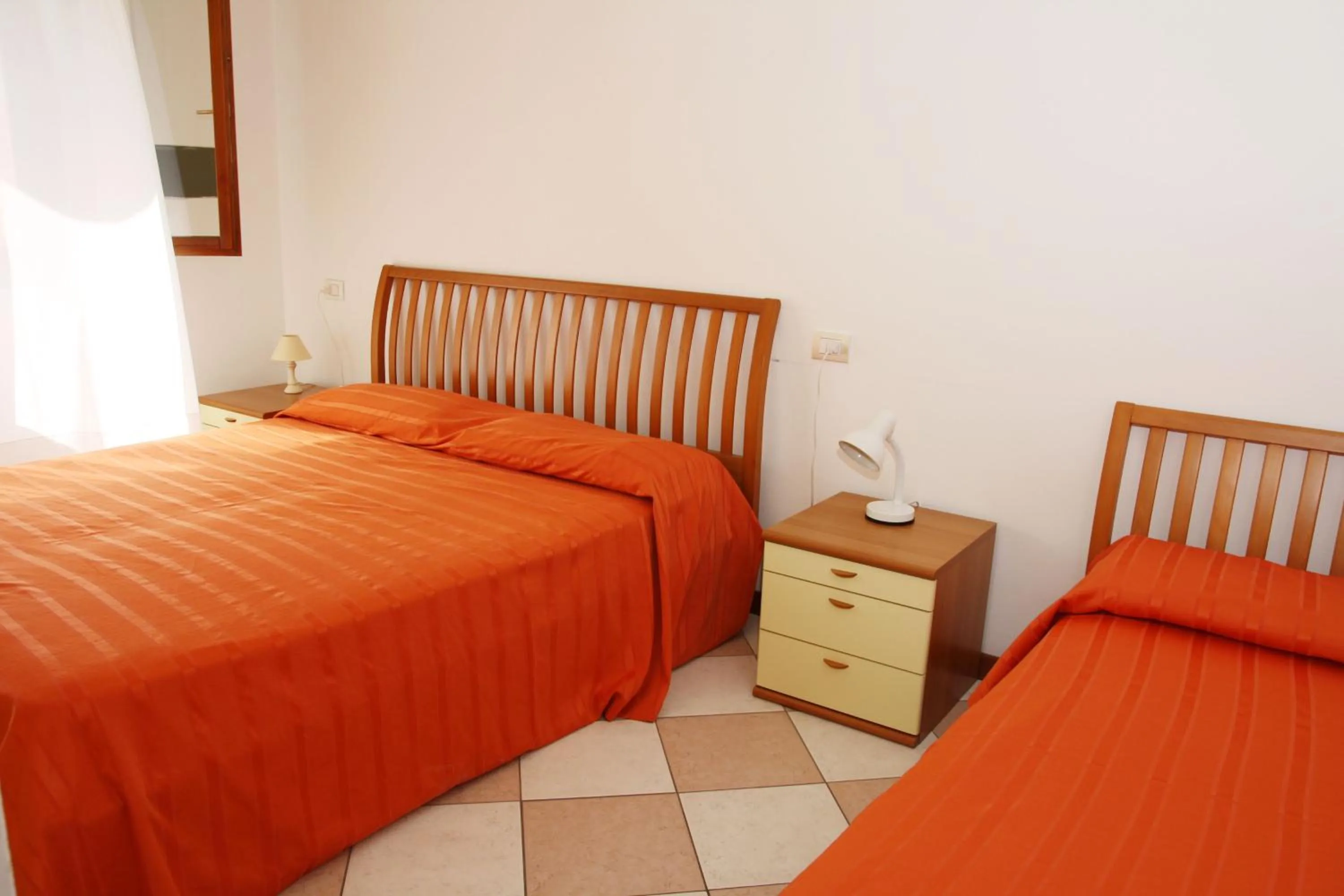 Bed in Family Apartments Residence Trieste