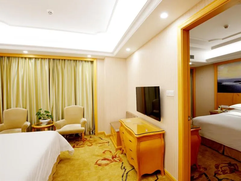 Bed in Vienna International Hotel Shenzhen Guangming Avenue