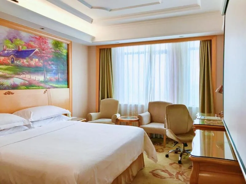 Bed in Vienna International Hotel Shenzhen Guangming Avenue