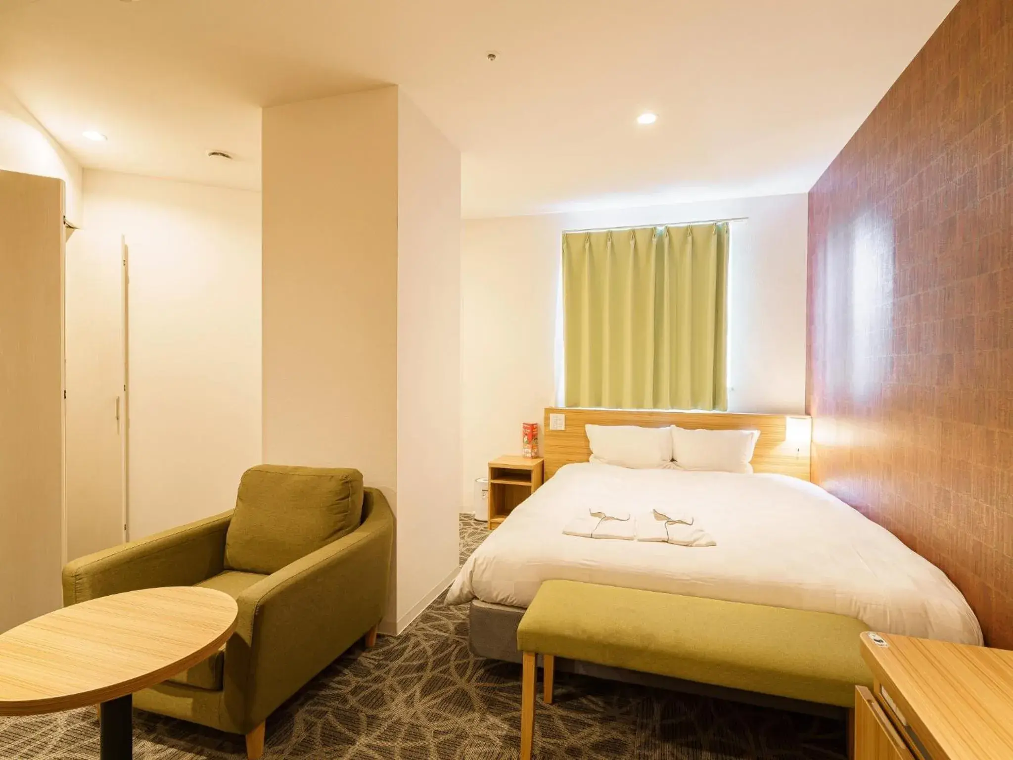 Seating area, Bed in Sakura Garden Hotel Seating area, Bed in Sakura Garden Hotel