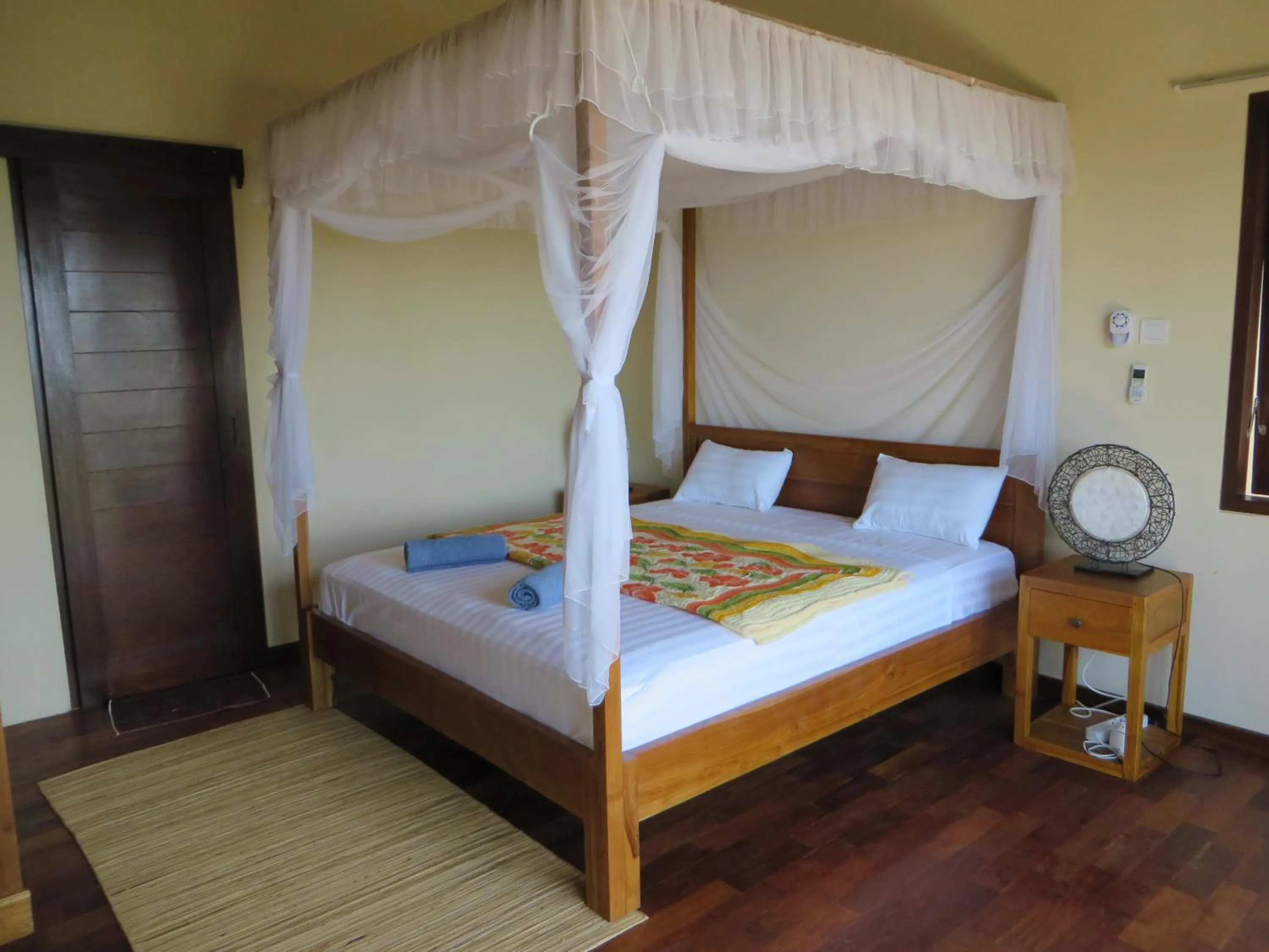 Bed in Jukung Dive Resort Bali AMED