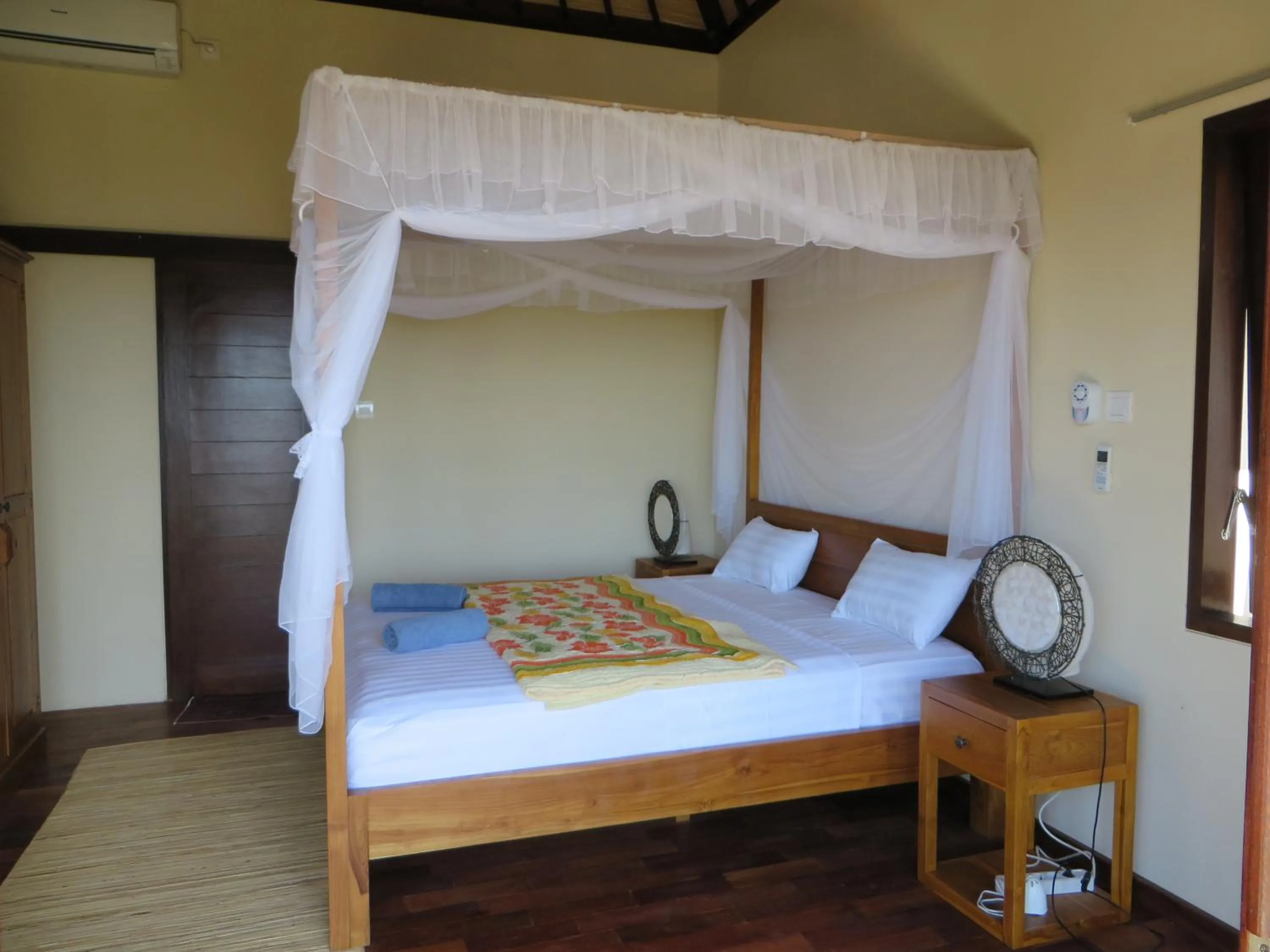 Bed in Jukung Dive Resort Bali AMED
