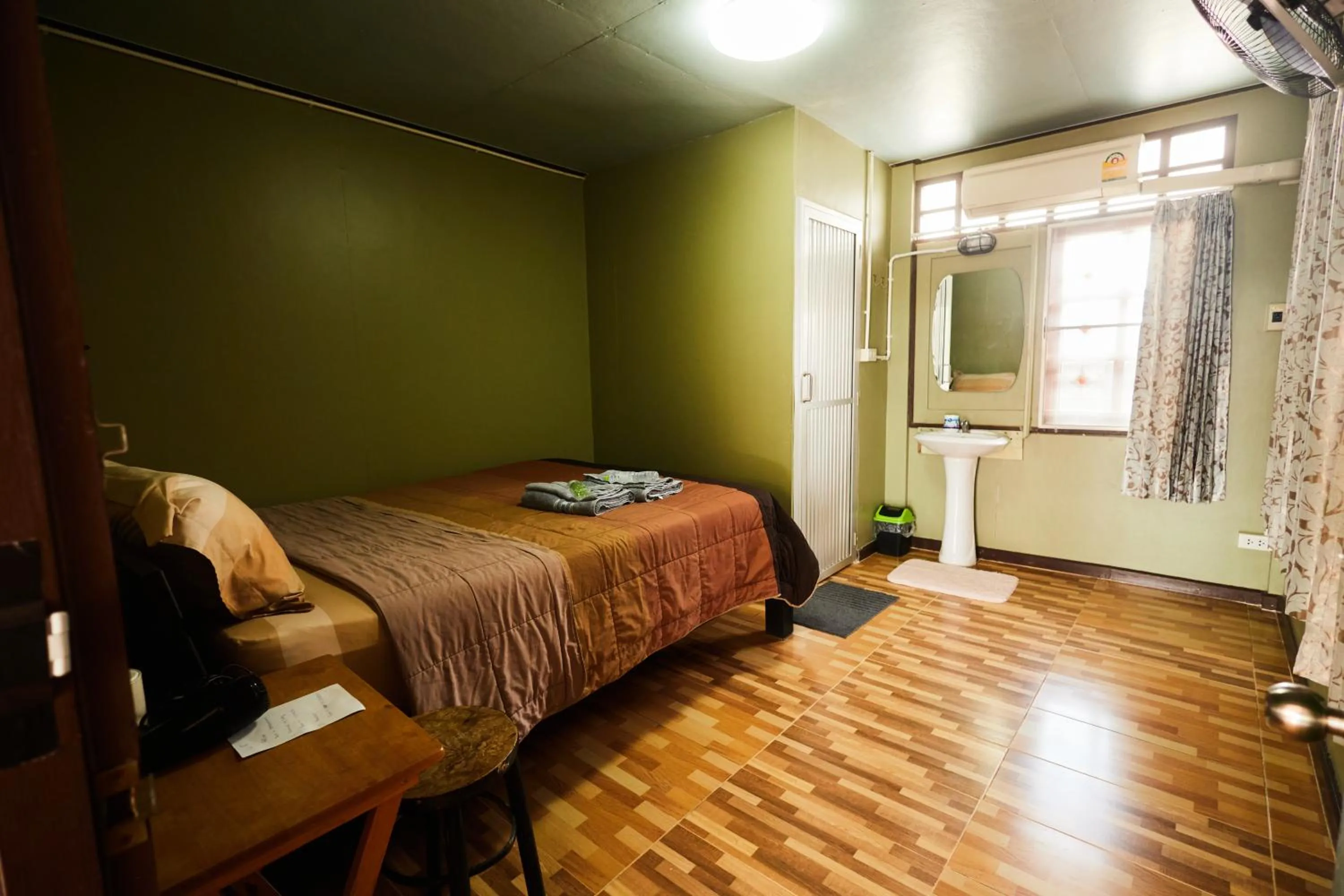 Bed in Chommuang Guest House