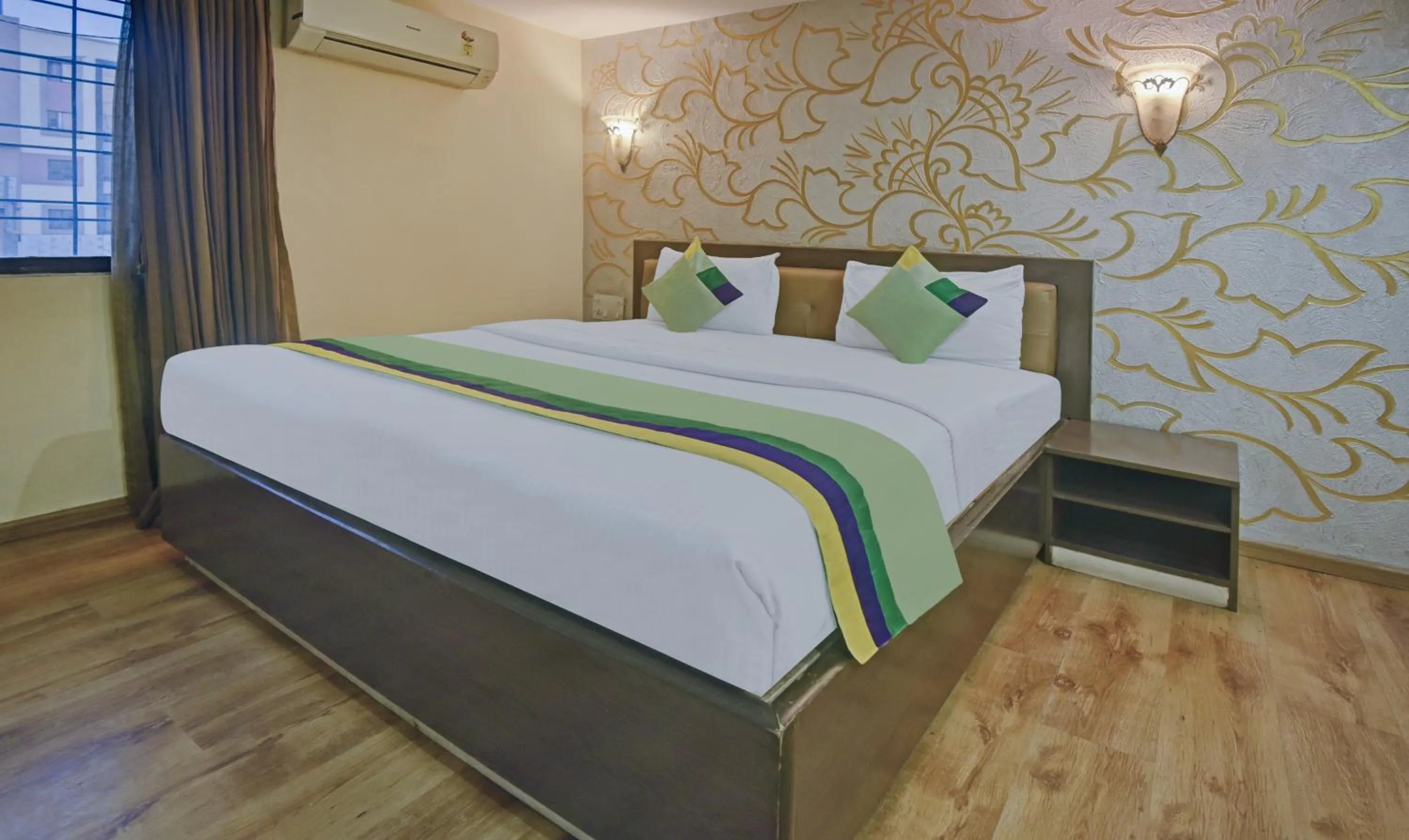 Bedroom, Bed in Treebo Savoury Sea Shell Residency